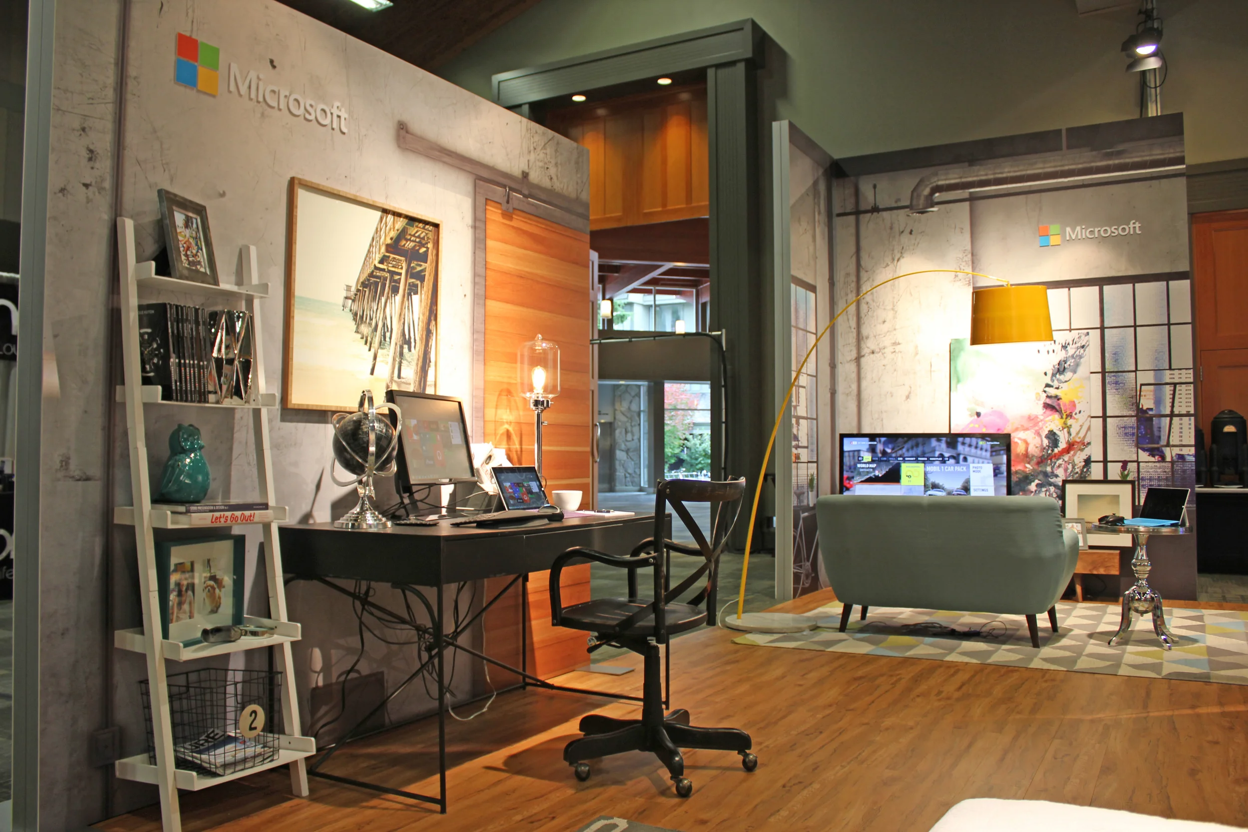 Large digitally printed graphics, wood flooring, and designer staging allows Microsoft to showcase product in an experiential way