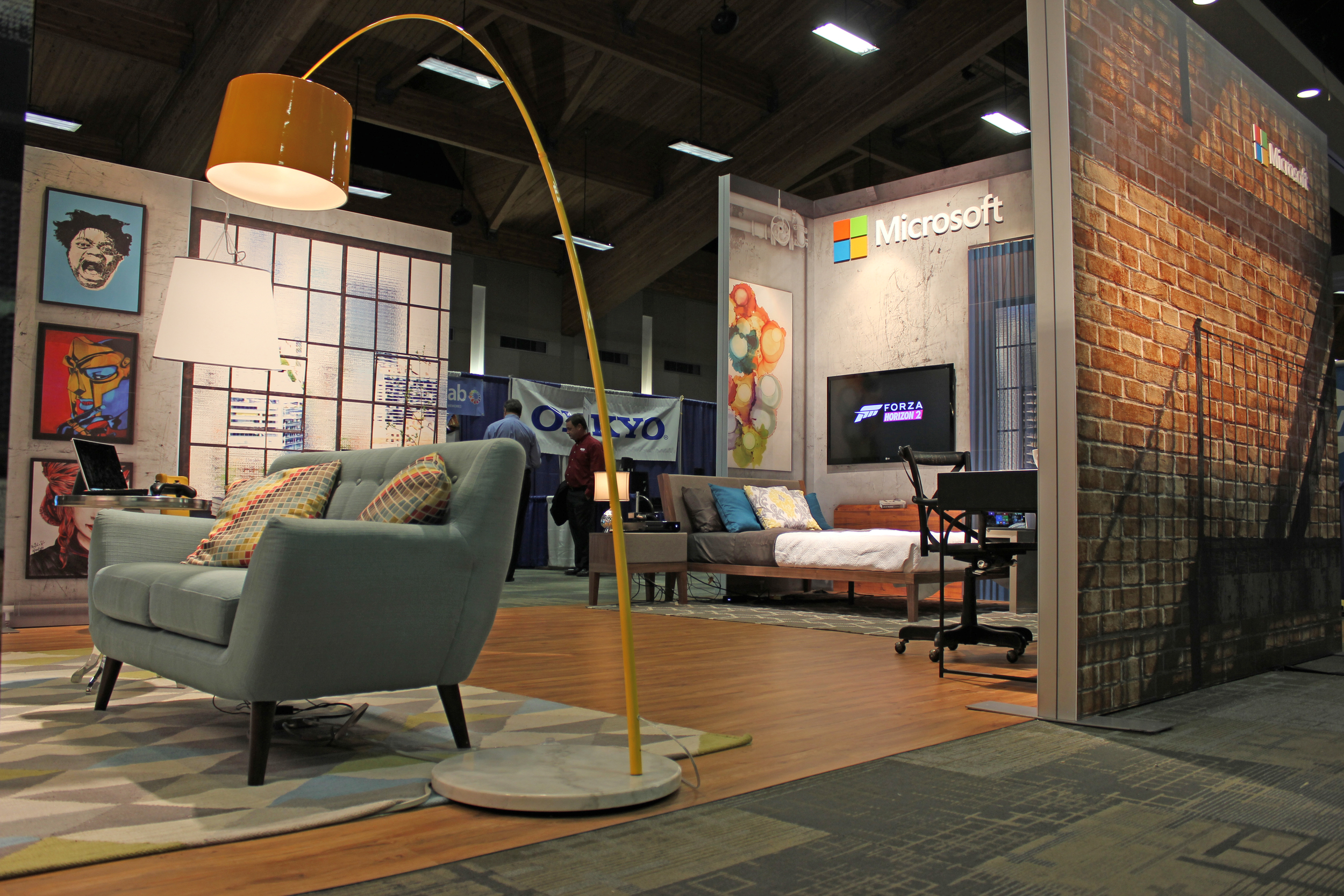 Large digitally printed graphics, wood flooring, and designer staging allows Microsoft to showcase product in an experiential way