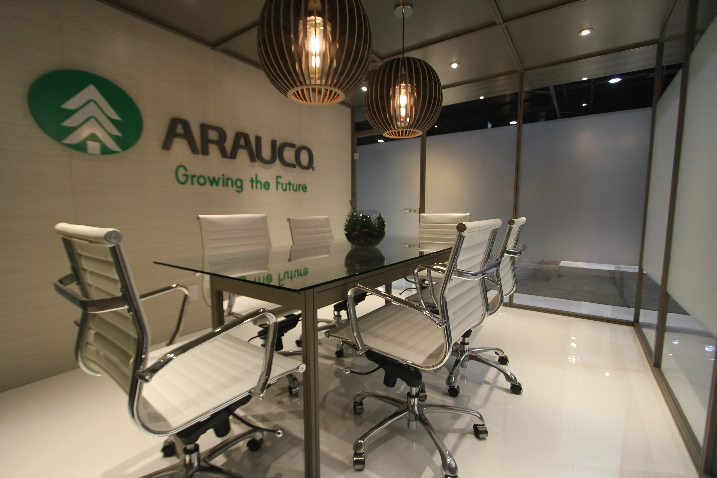The Arauco booth is a fully custom exhibit with cutom cabinetry and millwork incorporating the client's own wood products on the strucutre and in lighting