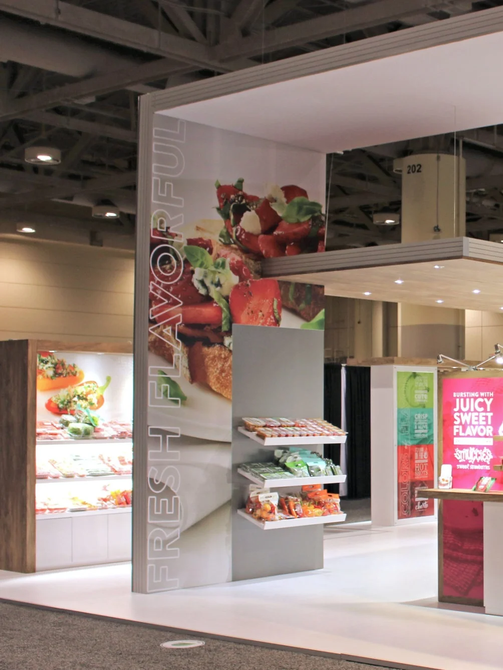 GRAPHICS Their graphics can be updated from show to show. We used printed PVC panels that can be easily removed and updated, vinyl graphics and wraps on laminated panels, as well as, dye-sub fabric graphics that can be replaced as branding changes.