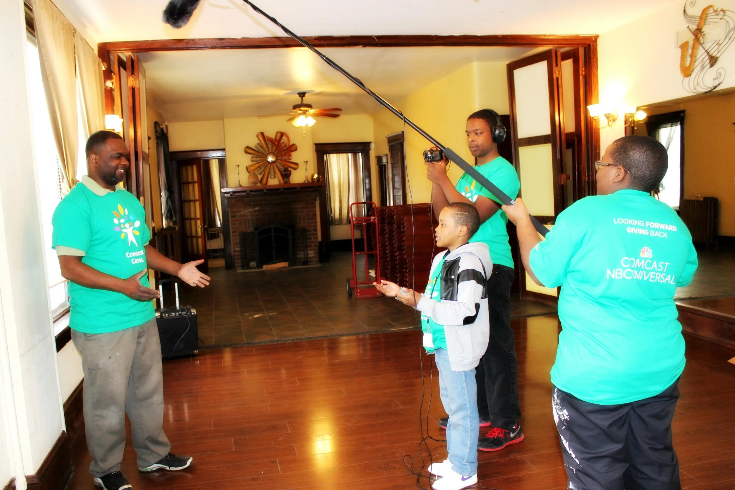 Ja'Reek Wiliams interviews Conservatory Mansion co-owner Sterick Ivey with Robert McGill on camera and Marquez Ellison on boom