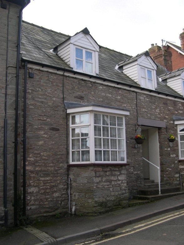  Number 5 Bear Street is to the left of the doorway 