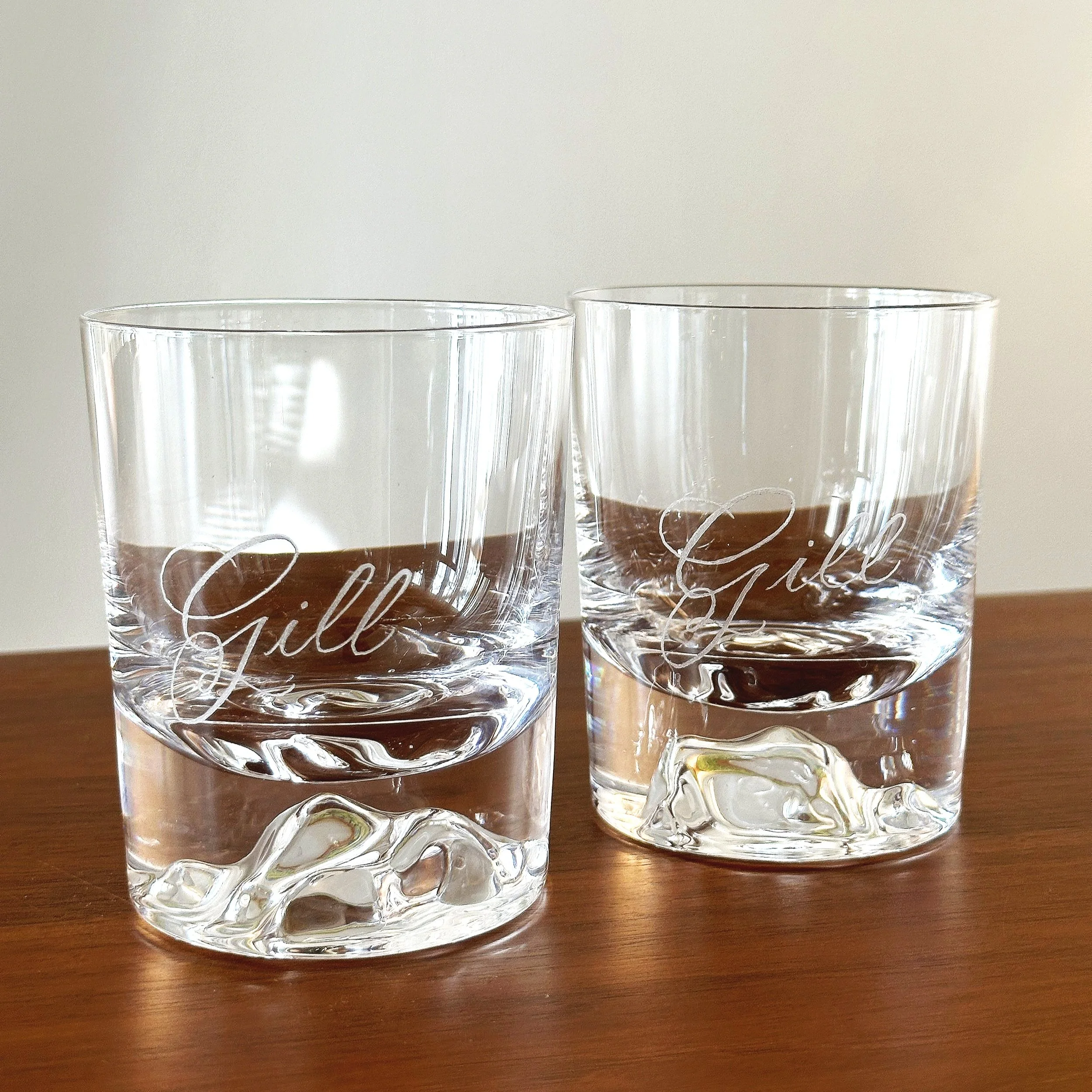 Engraved rocks glasses with calligraphy on custom glasses.