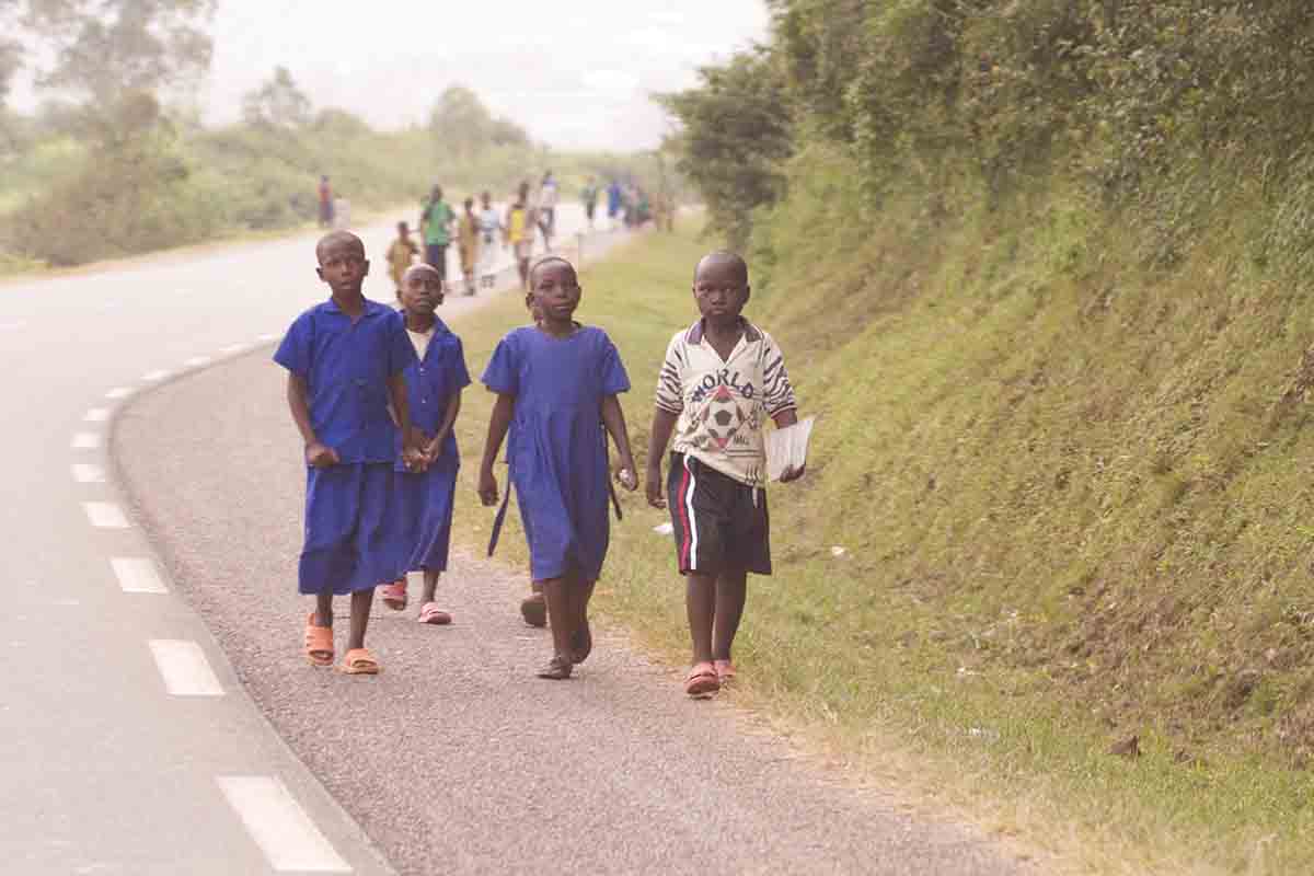 Children Walking to School Along Busy Road