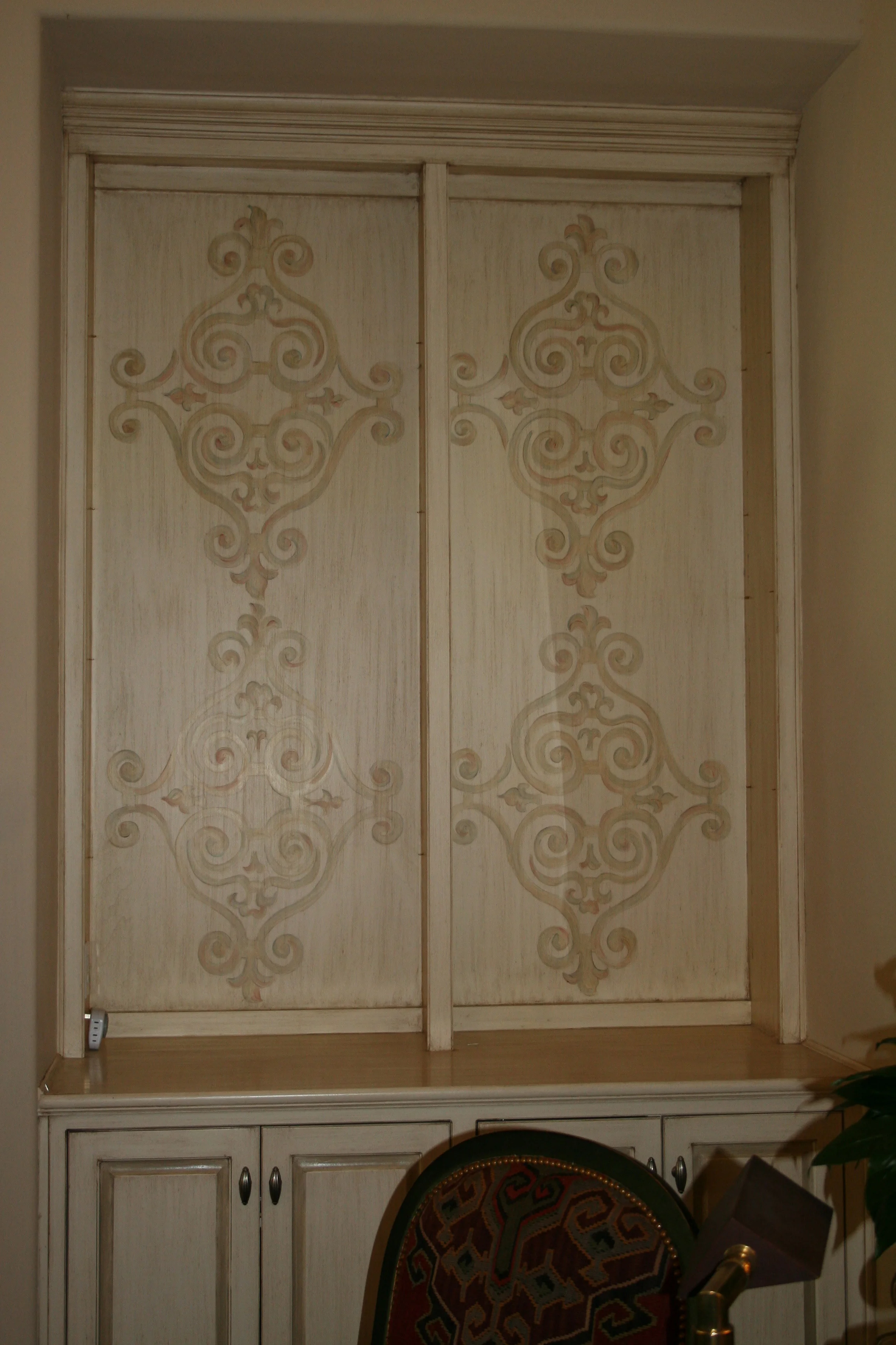 Custom hand painted patterns on cabinet doors
