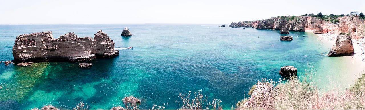 Panorama from atop the cliffs above the beaches of Lagos, Portugal.
Click the image for a larger view.