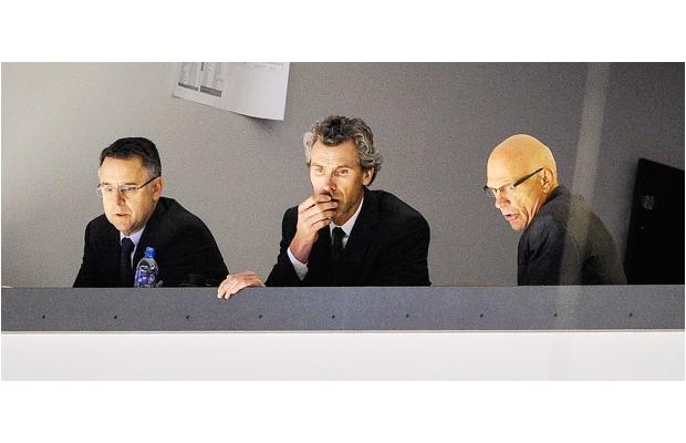 Trevor Linden (center) fired Canucks Assistant GMs Laurence Gilman (L), Lorne Henning (R).