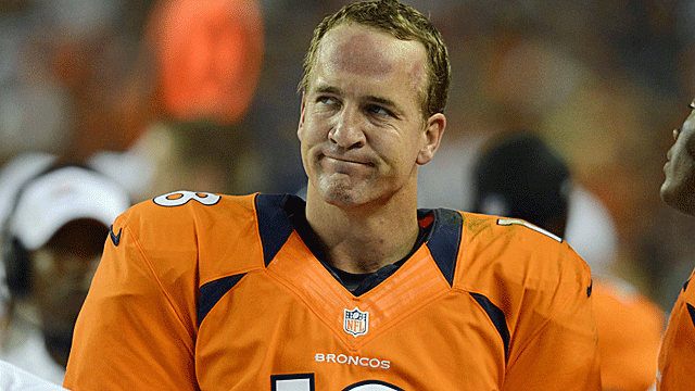 Peyton Manning seen contemplating his team's chances against Cam Newton's Panthers.