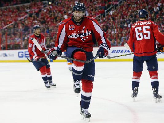 Troy Brouwer breaks his stick over his enormous balls.