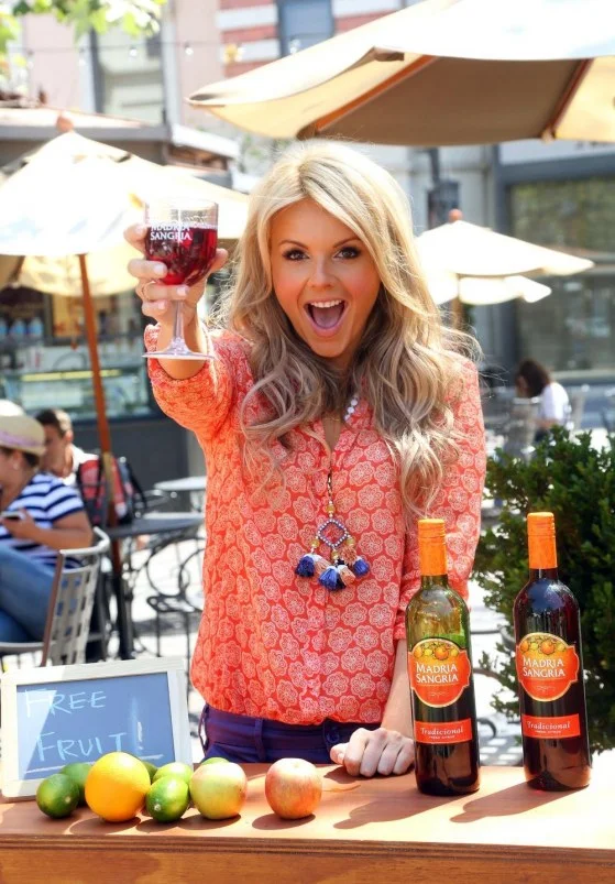 ali-fedotowsky-gears-up-for-cinco-de-mayo-at-the-madria-sangria-fruit-stand-april-the-grove-los-angeles-holding-glass-1303111094.jpg