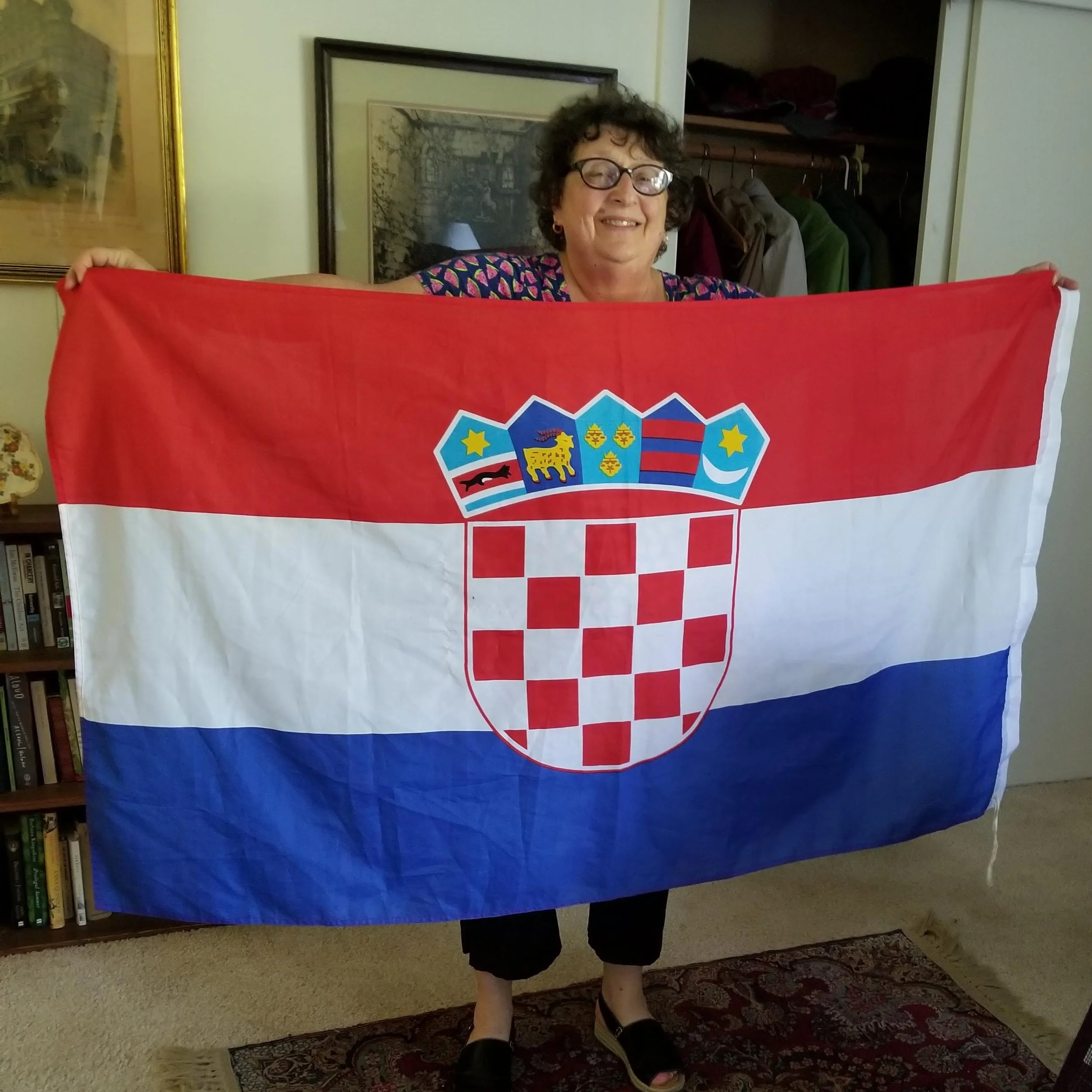 Kresha Warnock, pictured with a Croatian flag - celebrating after Croatia beat Russia in the World Cup