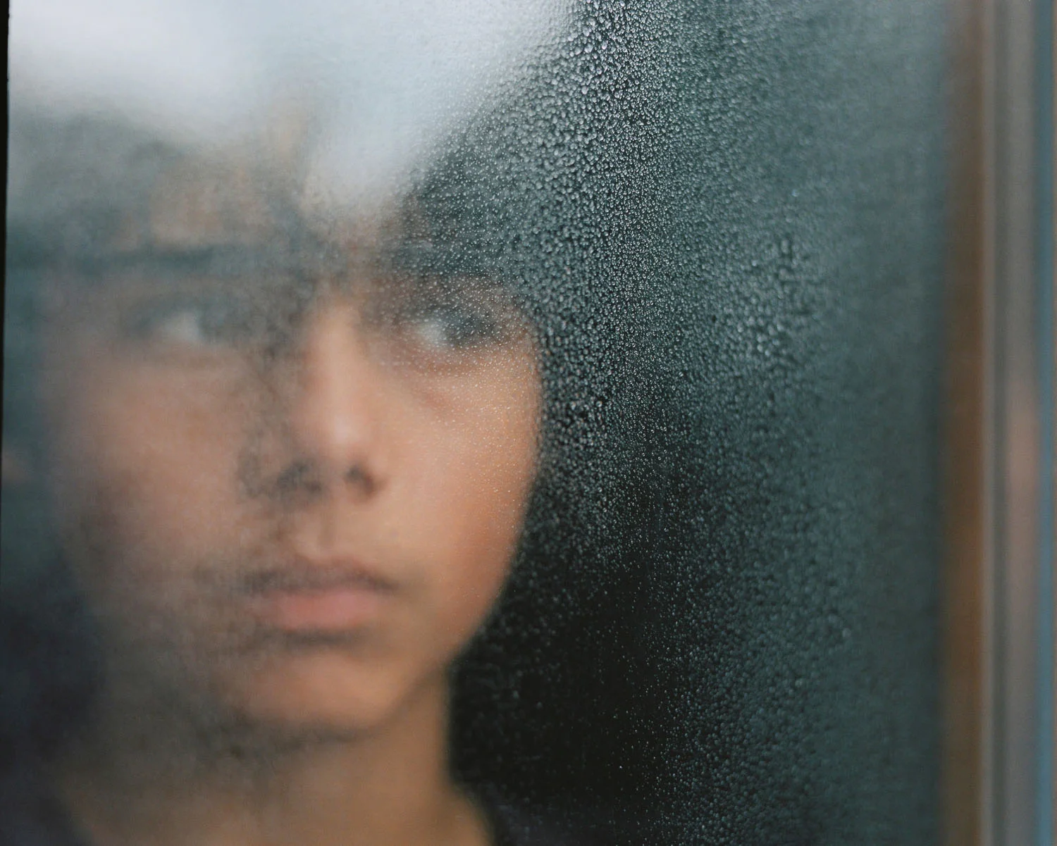 Having worked pro-bono with Missing Children Europe for the past few years I’ve come to understand the different phenomena of missing children. What I’ve learnt to appreciate is how in many cases the issues simply aren’t clear cut; that behind every case of missing children there is often a complex background and history to understand and unravel. This need to give more attention to these vulnerable and overlooked groups gave me the idea to shoot these three true stories of missing children literally out-of-focus. Losing Myself is an artistic interpretation, shot on a medium format camera, of the 3 most common, yet over-looked phenomena of missing children - unaccompanied migrant children, teenage runaways and parental abduction.