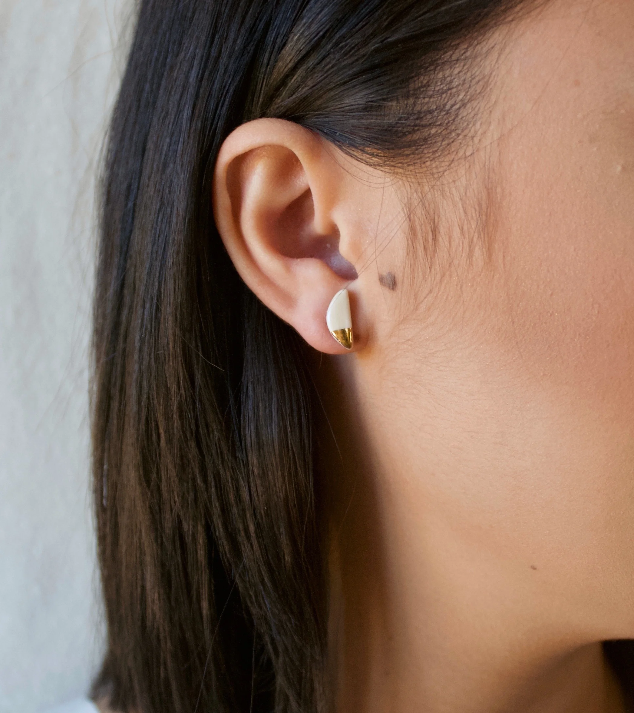 ZOË COMINGS model teeny half pebble studs nude:gold sl square.jpg