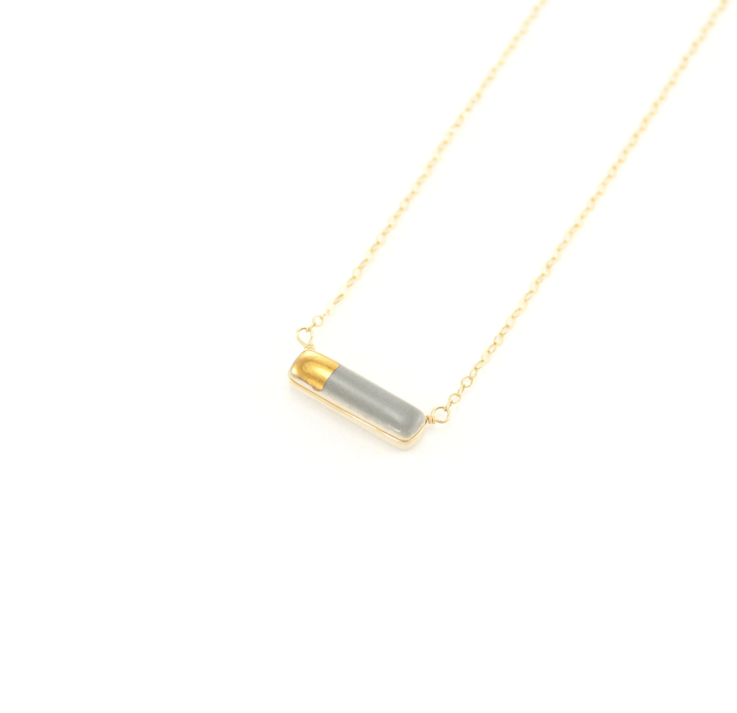 ZO%C3%8B+COMINGS+teeny+reed+necklace+dark+grey%3Agold+angle.jpg