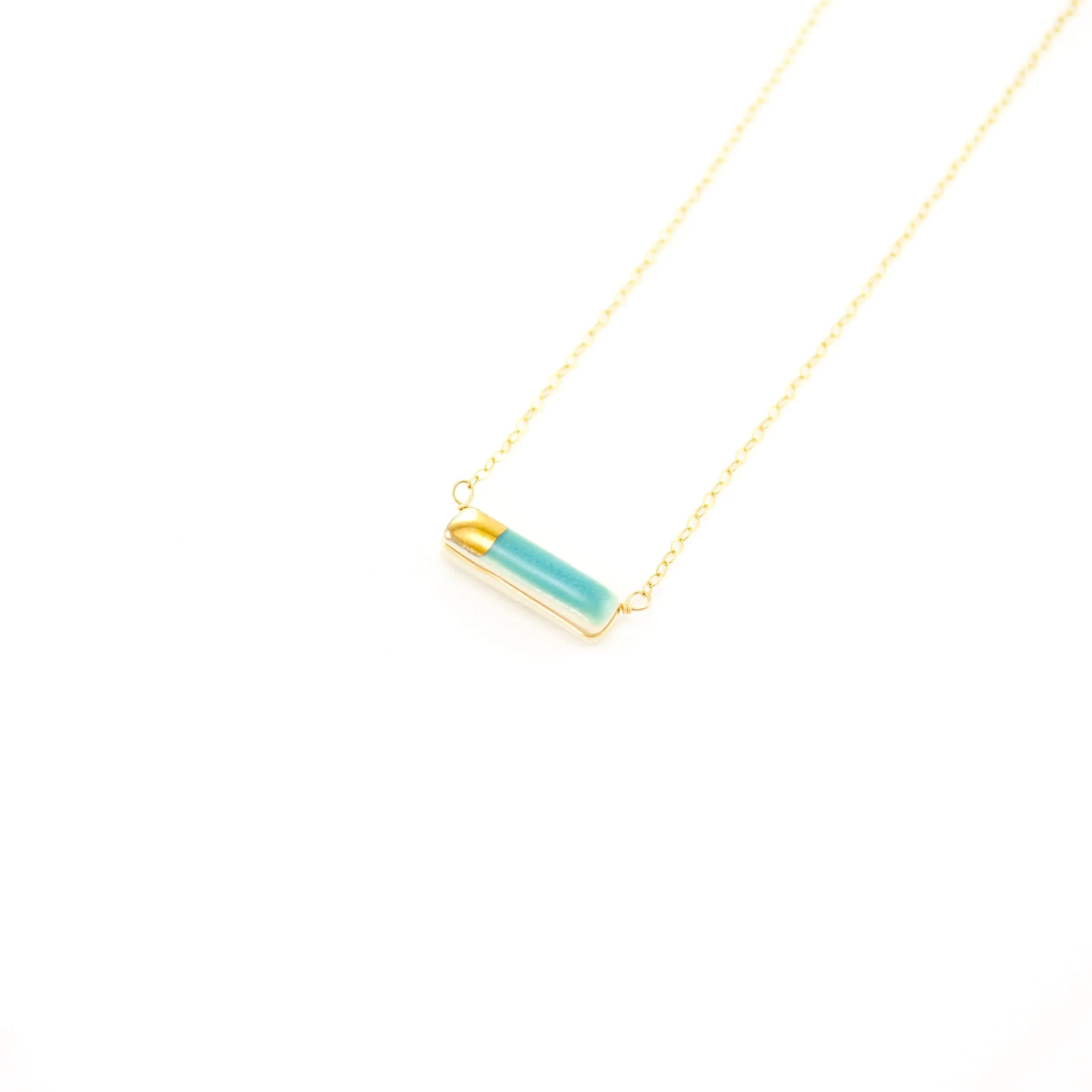 ZOË COMINGS teeny reed necklace teal:gold, angle.jpg