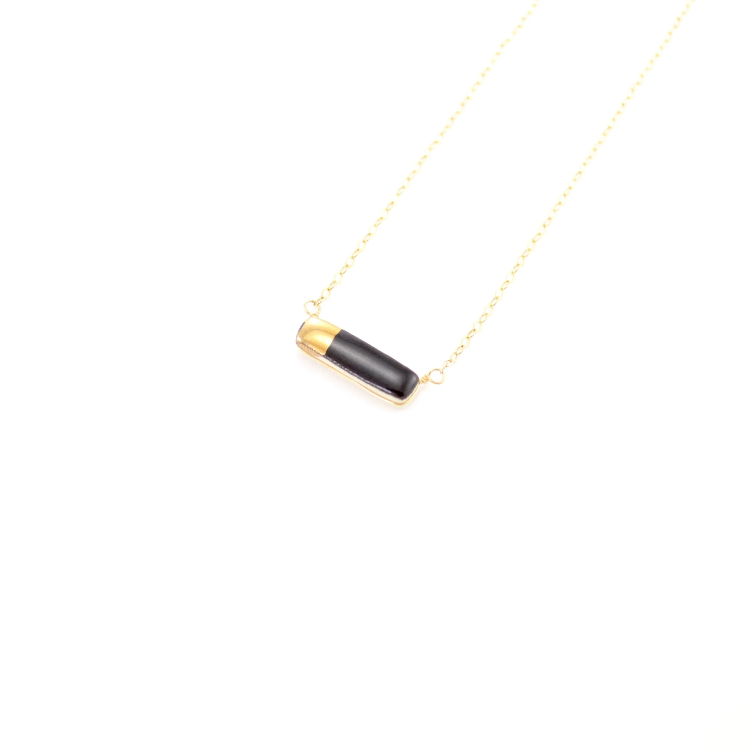 ZOË COMINGS teeny reed necklace black:gold, angle.jpg