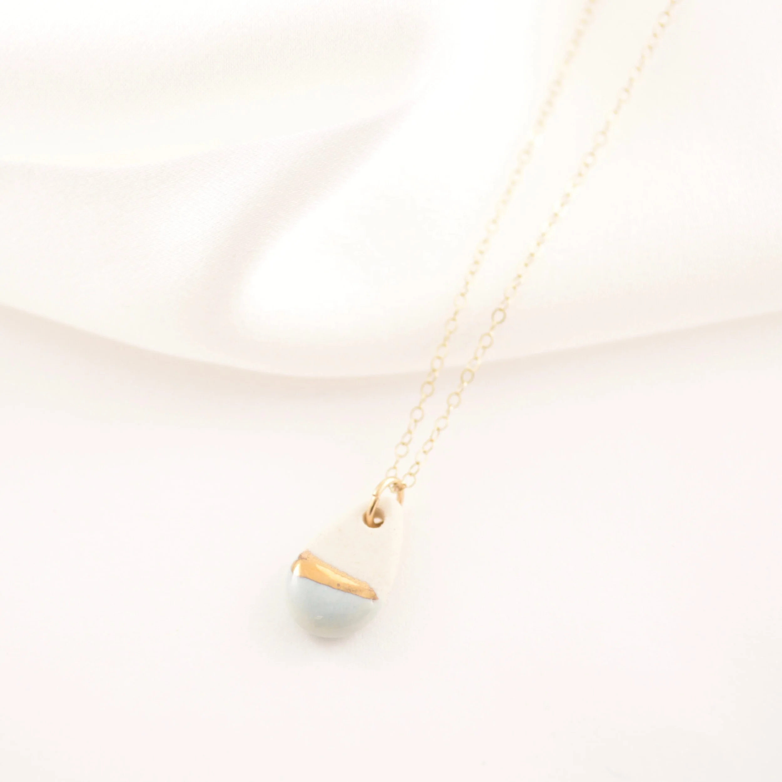 ZOË COMINGS tiny teardrop necklace pale blue:gold silk.jpg