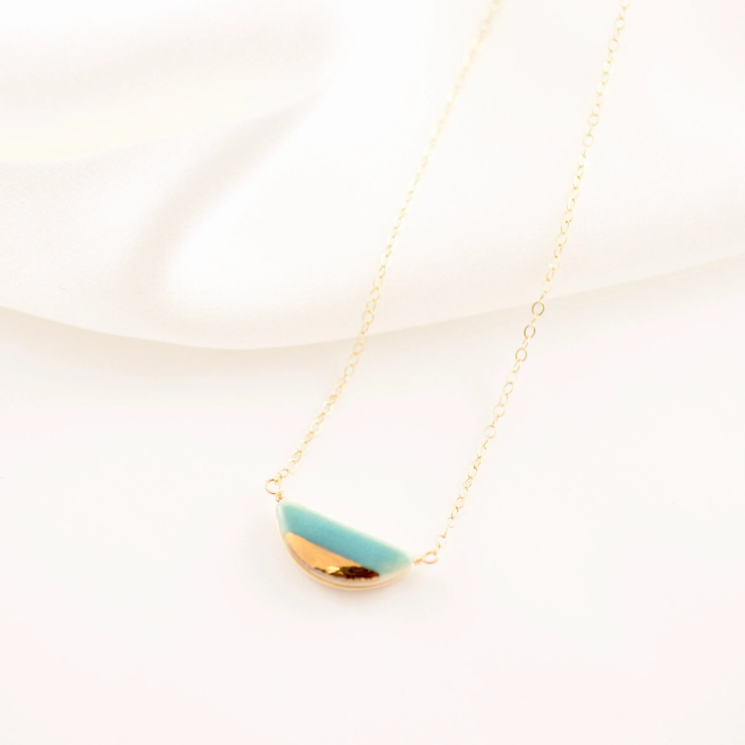ZOË COMINGS teeny half pebble necklace teal:gold silk.jpg