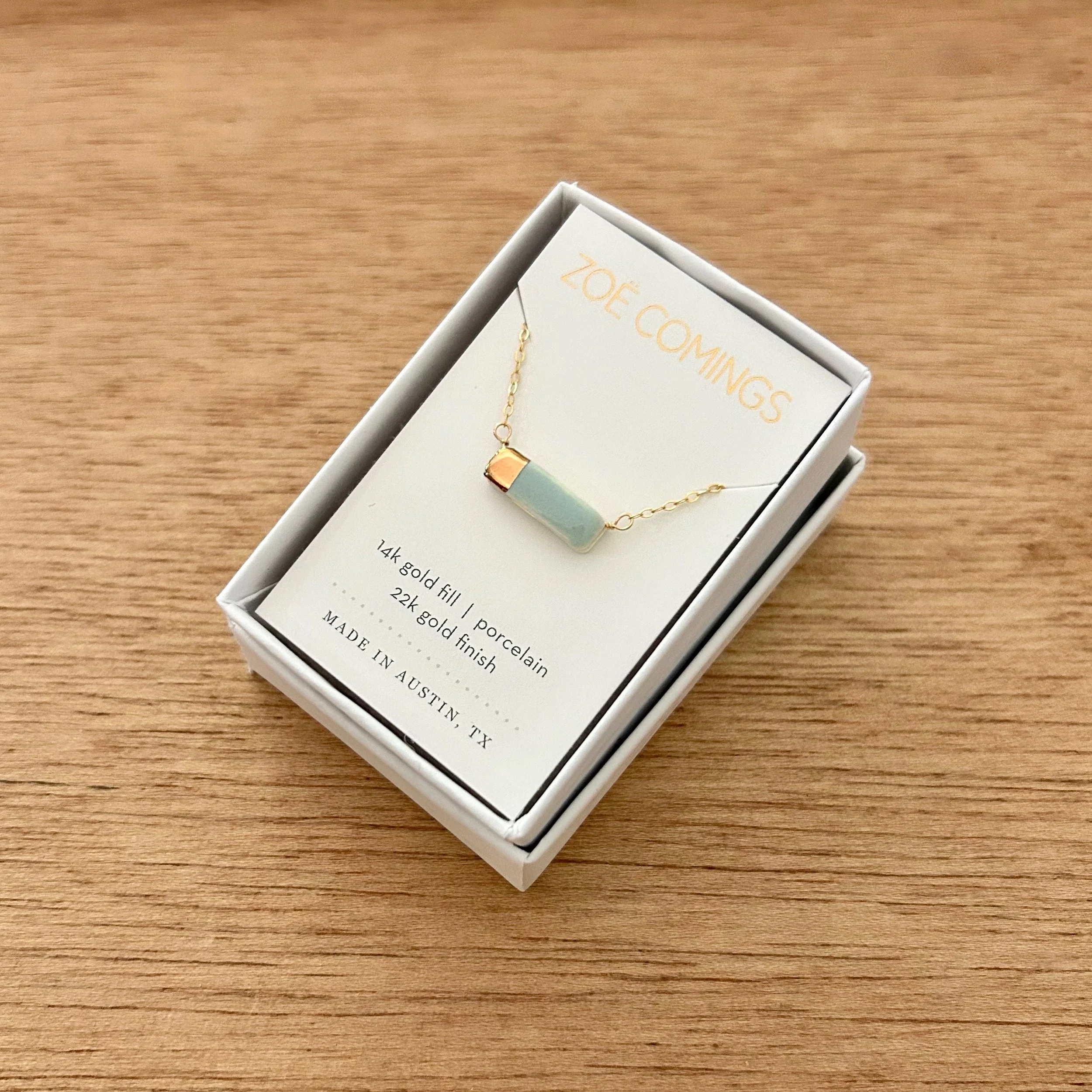 ZOË COMINGS teeny reed necklace, pale blue boxed a.jpg