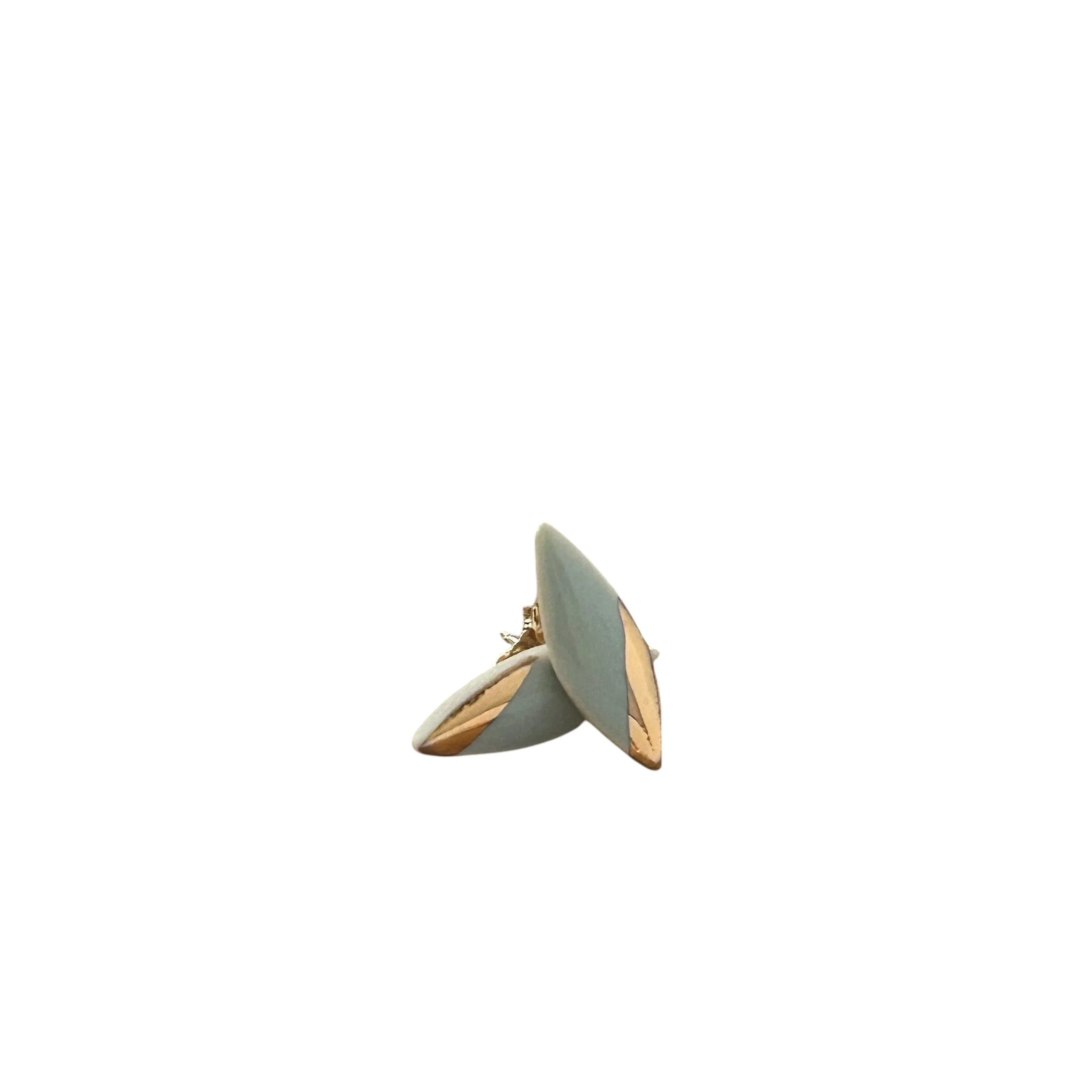 ZOË COMINGS tiny leaf studs, dark grey:gold angle, stacked wbg.jpeg