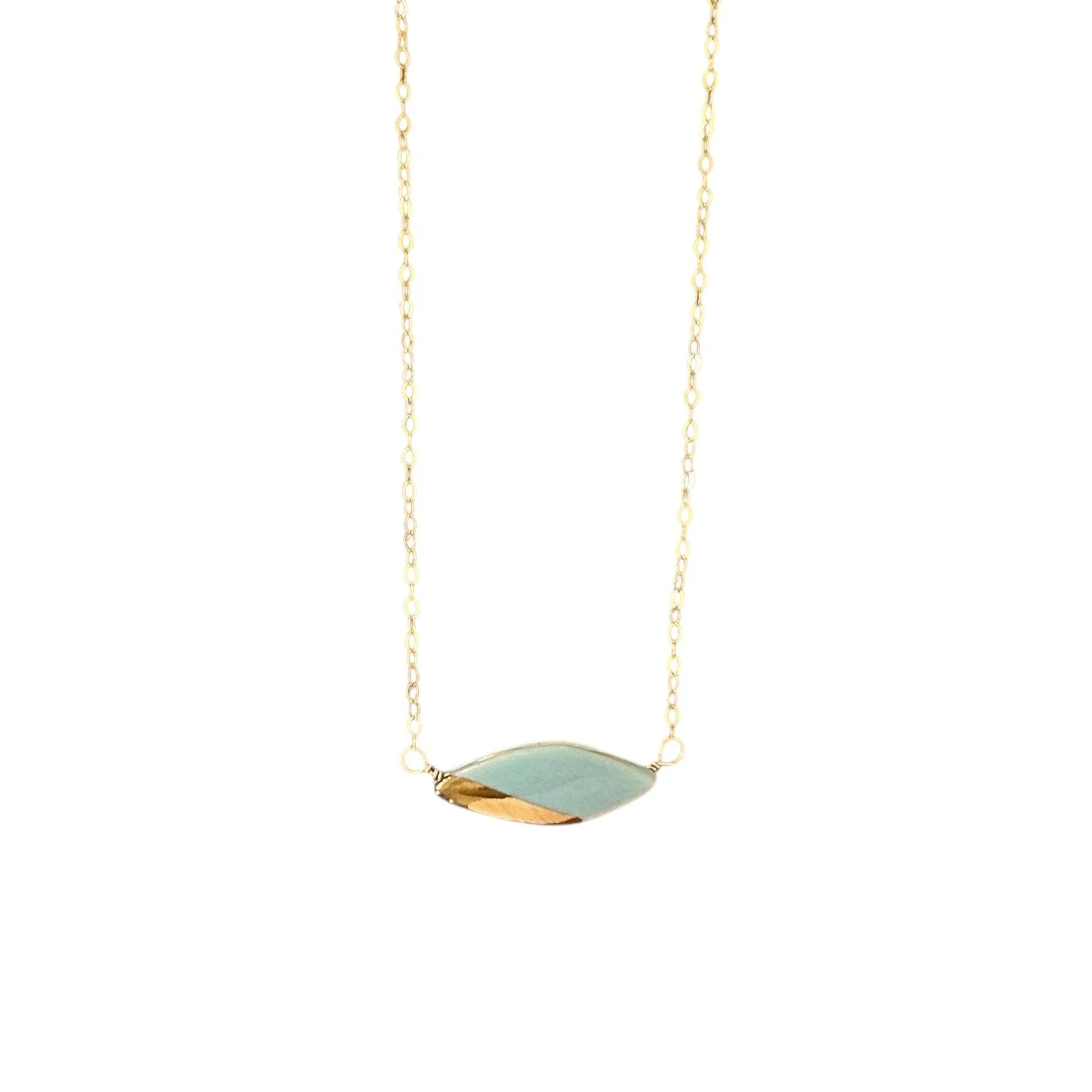 ZOË COMINGS teeny leaf necklace, pale blue:gold wbg.jpeg