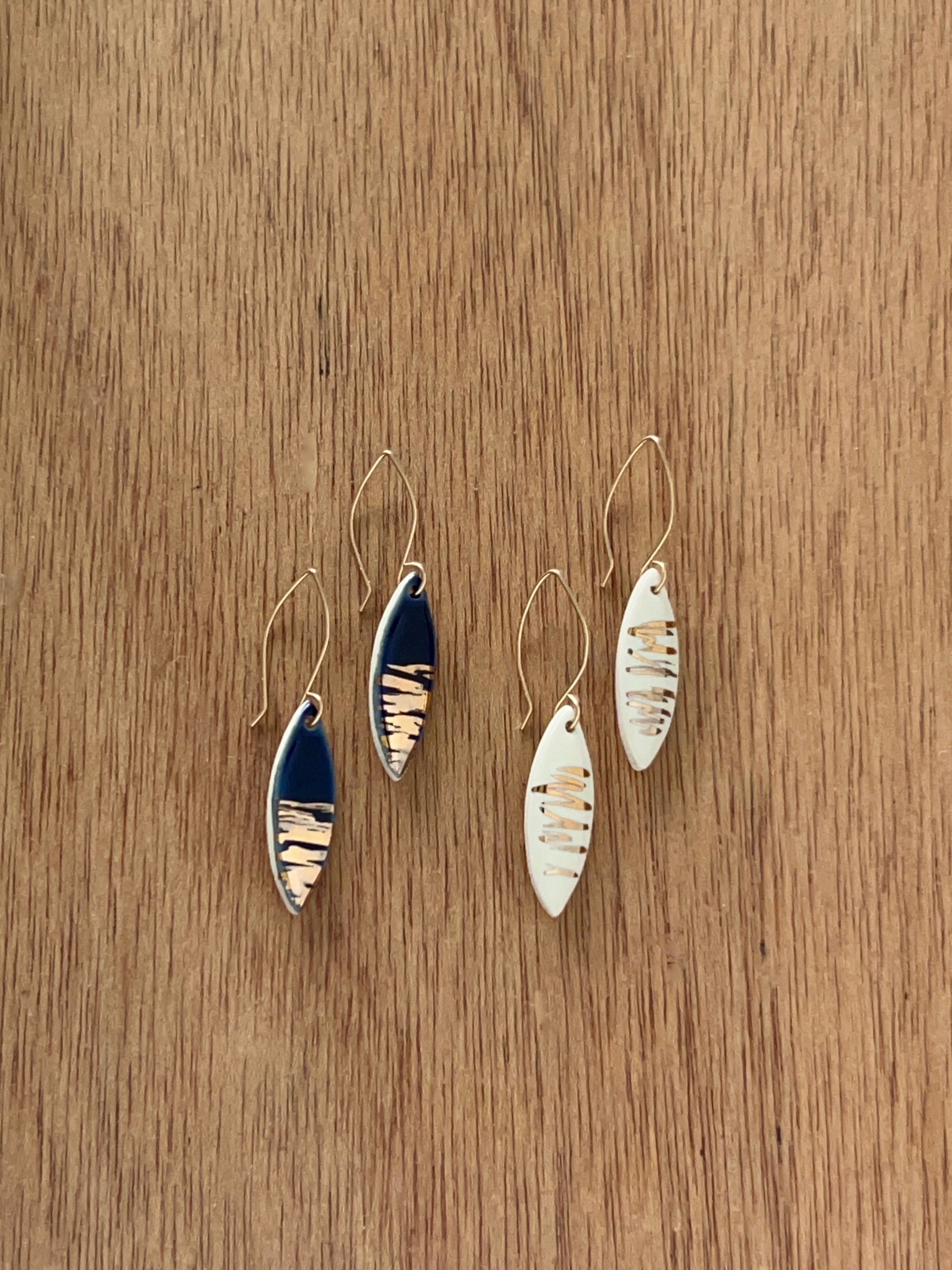 ZOË COMINGS leaf earrings, shimmer navy + white wdbkg.jpg