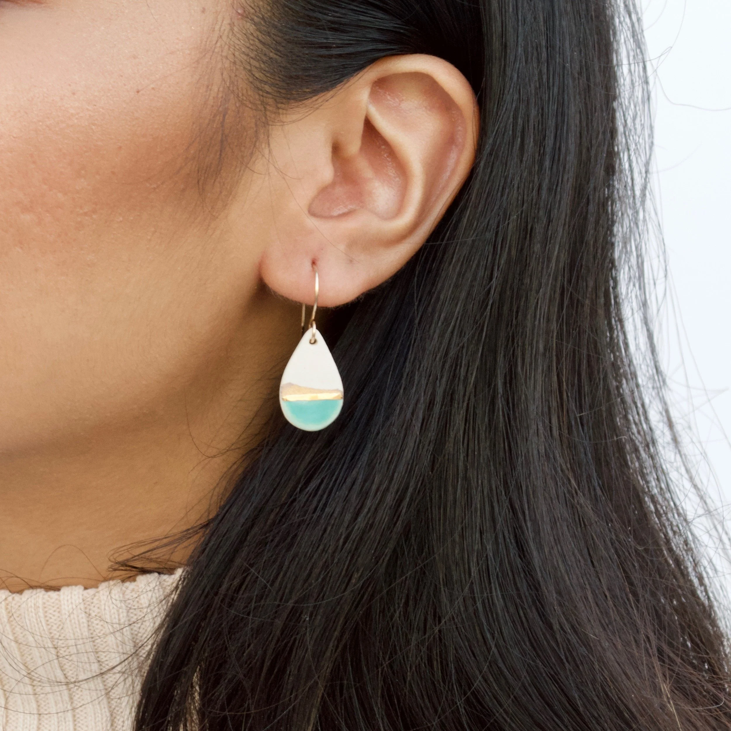 ZOË COMINGS teardrop drop earrings, teal:gold line, model.jpeg