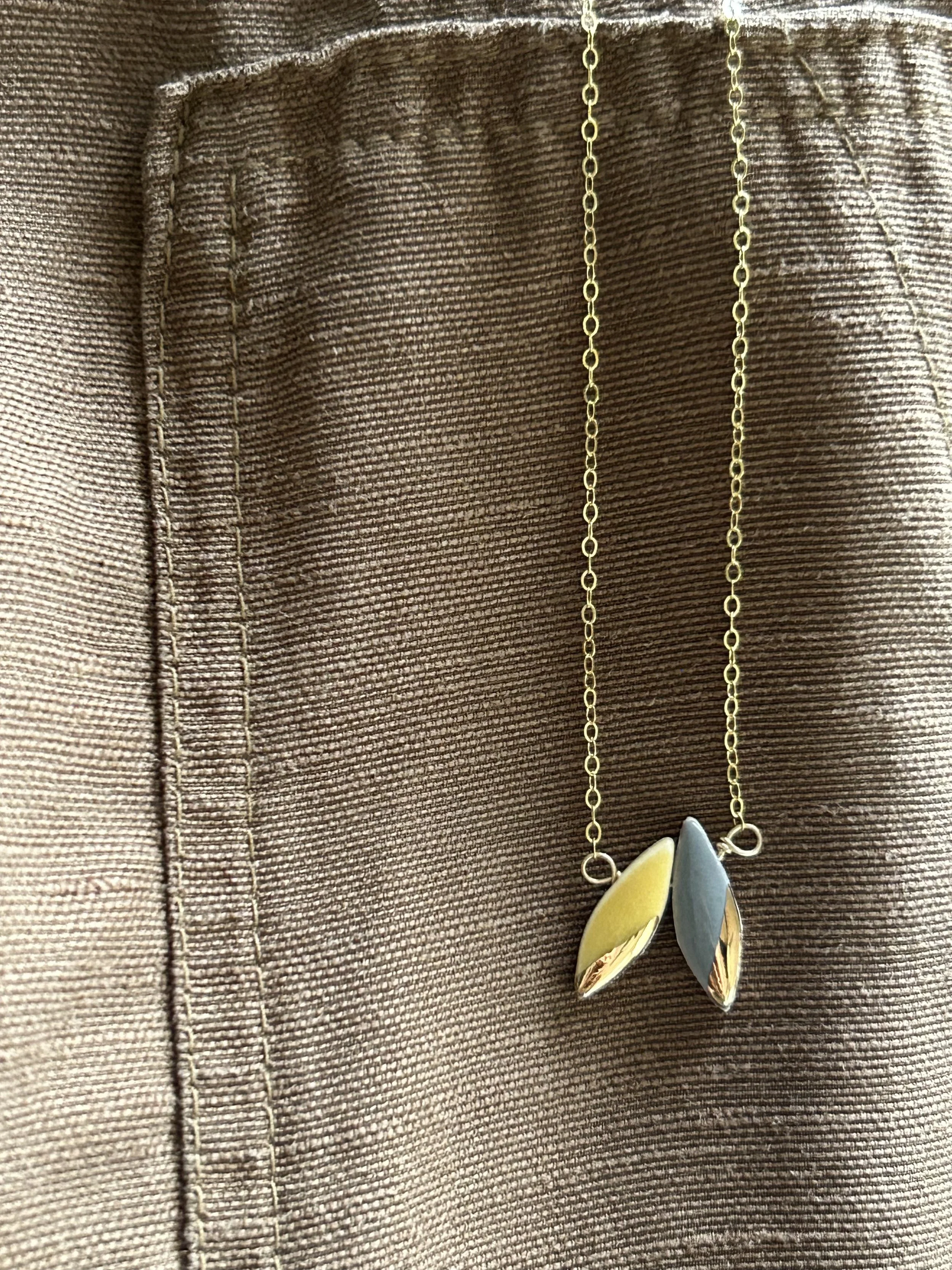 ZOË COMINGS double leaf necklace mg:dk lifestyle pug.jpg