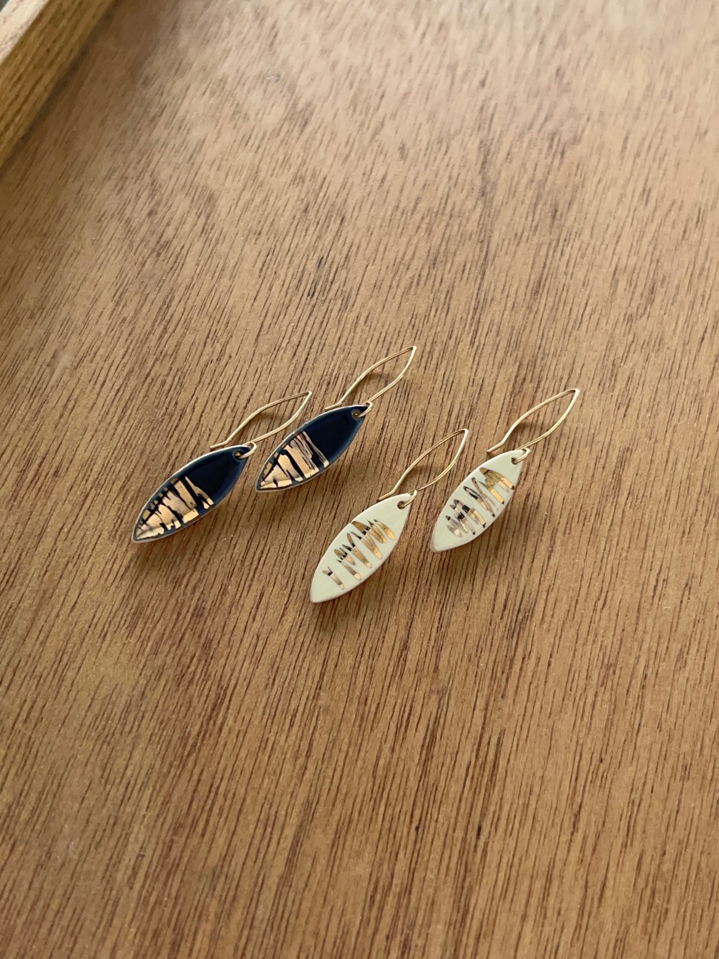 ZOË COMINGS leaf earrings, shimmer navy + white wdbkg a.jpg