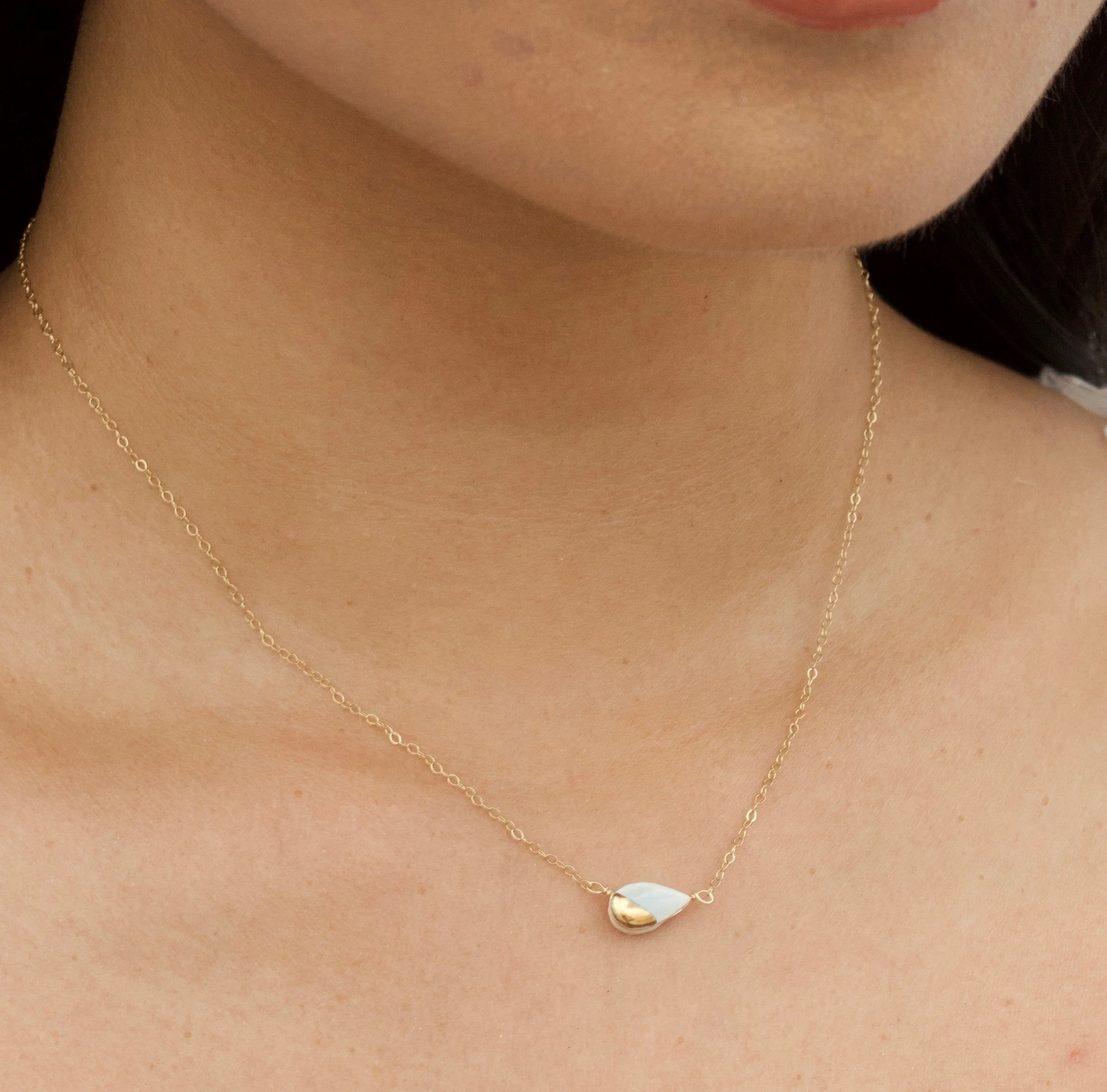 ZOË COMINGS  teeny petal necklace pale blue:gold model.jpg