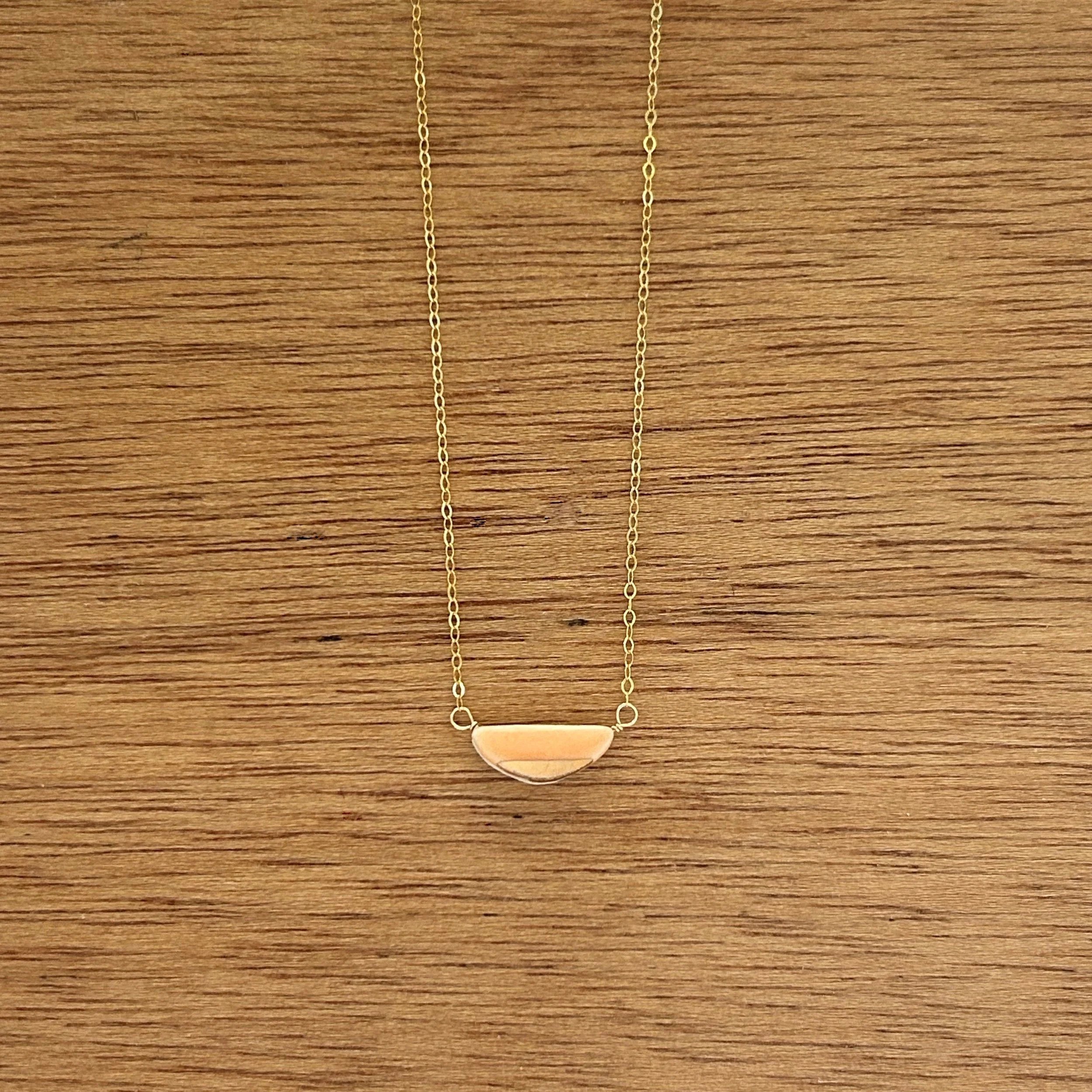 ZOË COMINGS teeny half pebble necklace, bright orange:gold, wdbkg.jpg