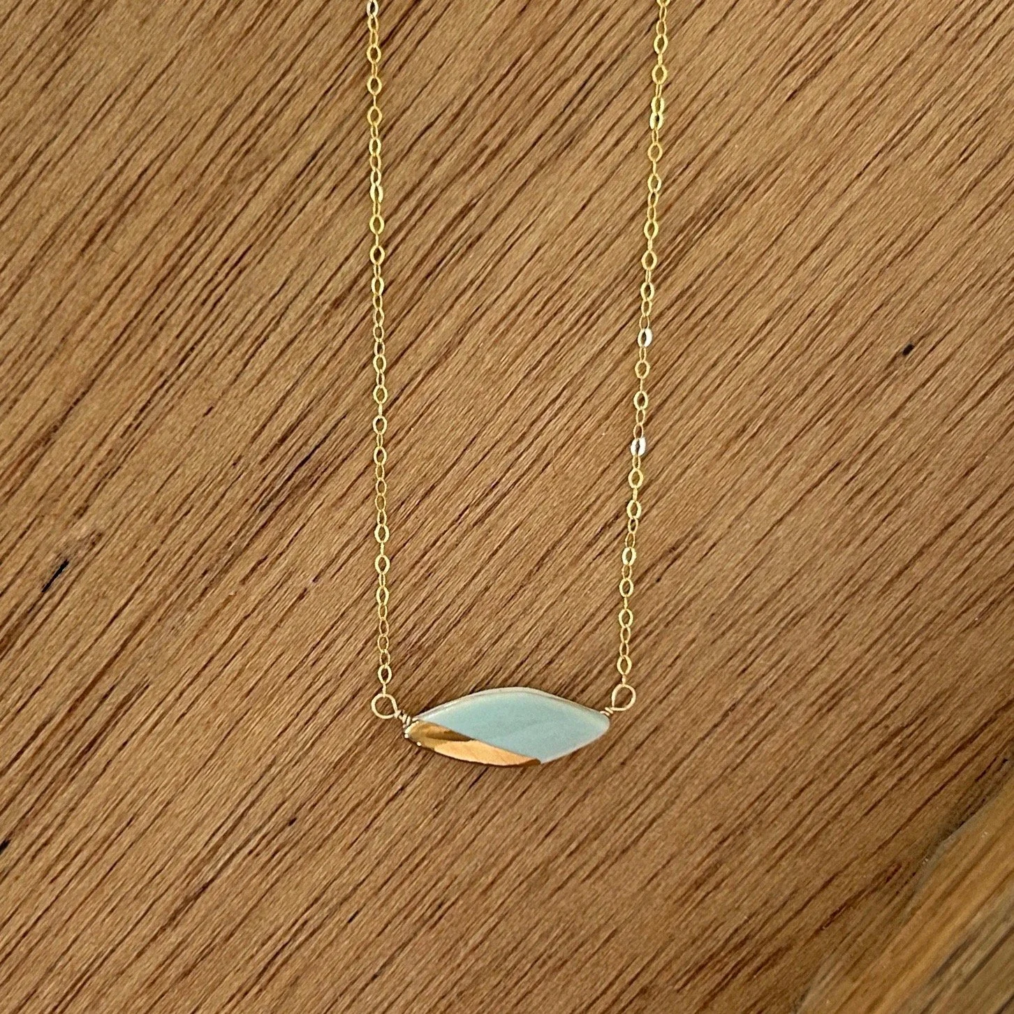 ZOË COMINGS teeny leaf necklace, pale blue, wdbkg.jpg