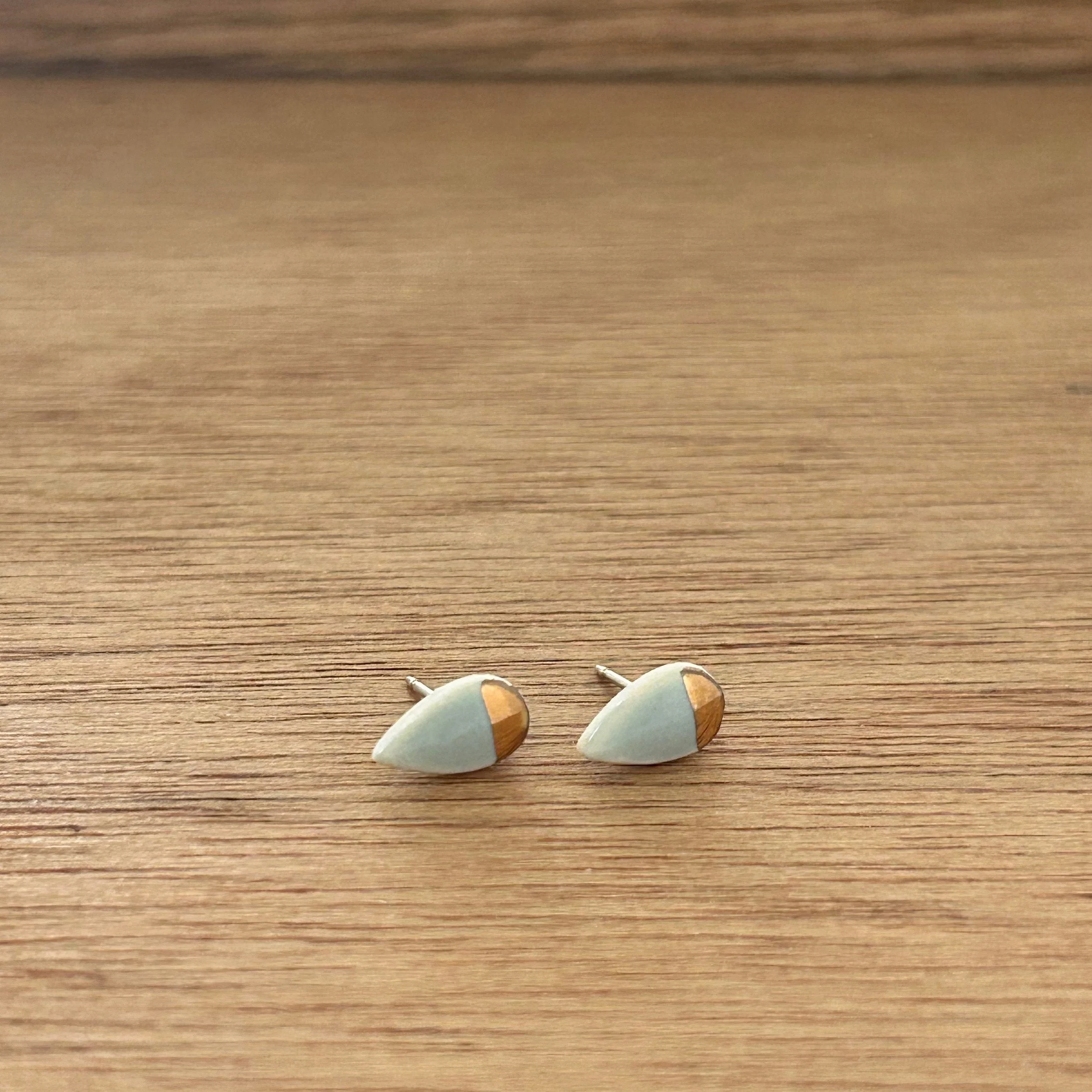 ZOË COMINGS tiny petal studs, pale blue:gold half, a wdbkg.jpg