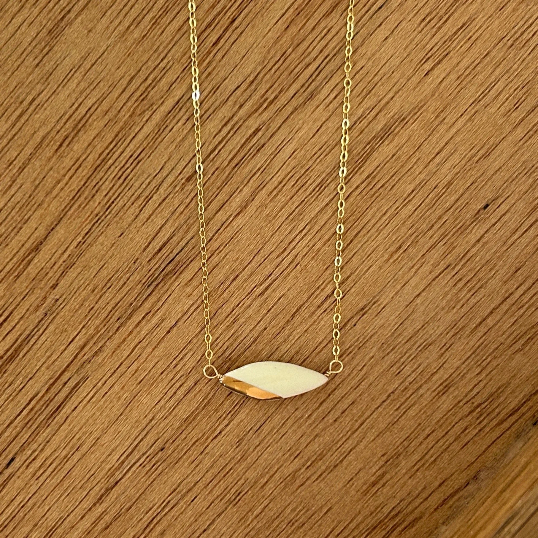 ZOË COMINGS teeny leaf necklace, white, wdbkg.jpg