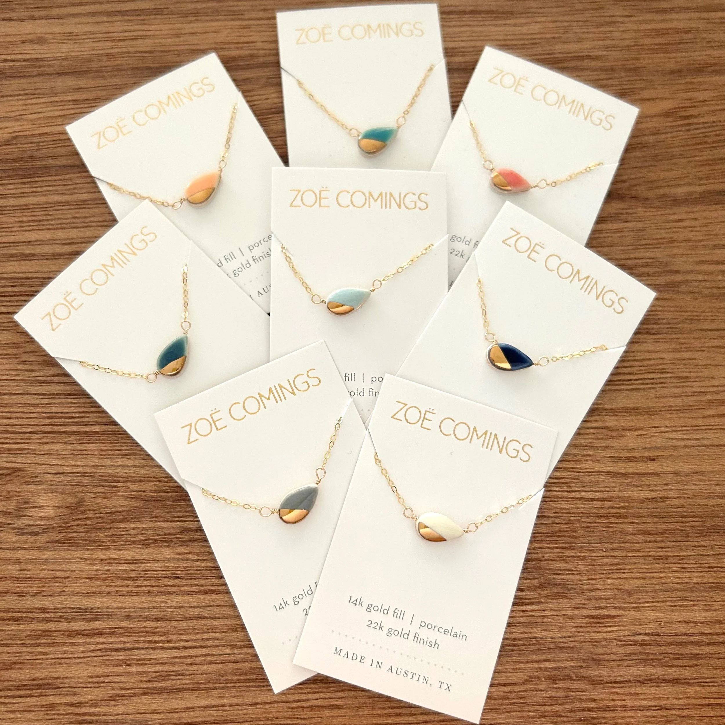 ZOË COMINGS teeny petal necklace, 8 w:bl:tl:or:dk, wdbkg.jpg