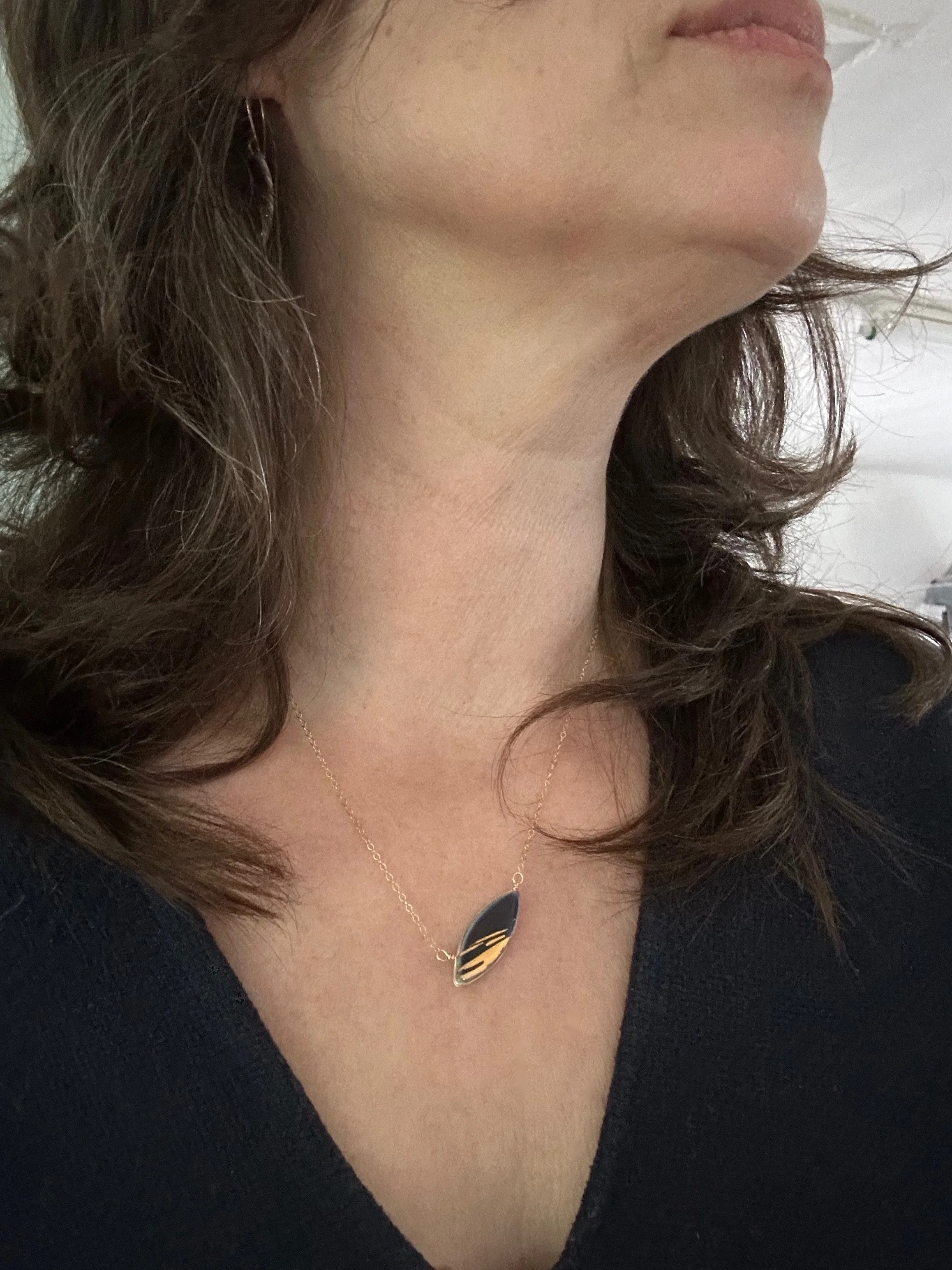 ZOË COMINGS model leaf necklace, shimmer navy.jpg