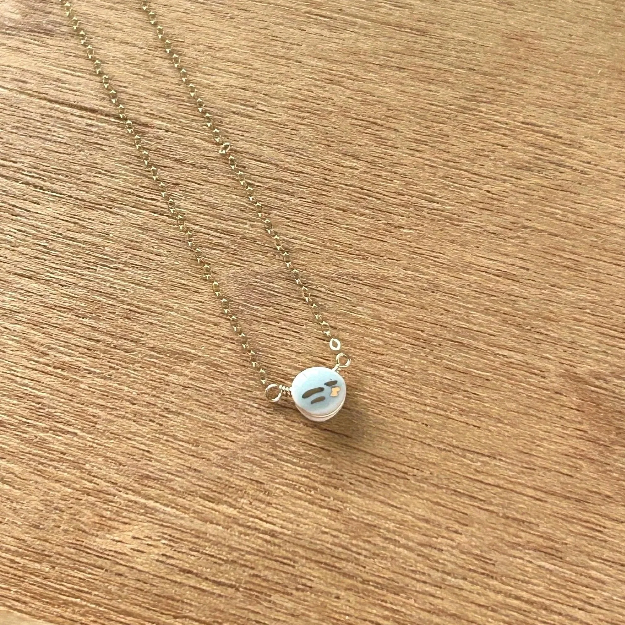 ZOE%2525CC%252588%252BCOMINGS%252Bteeny%252Bpebble%252Bnecklace%252Bpale%252Bblue%25253Agold%252Bstripe%252Bwdbkg%252Ba.jpg