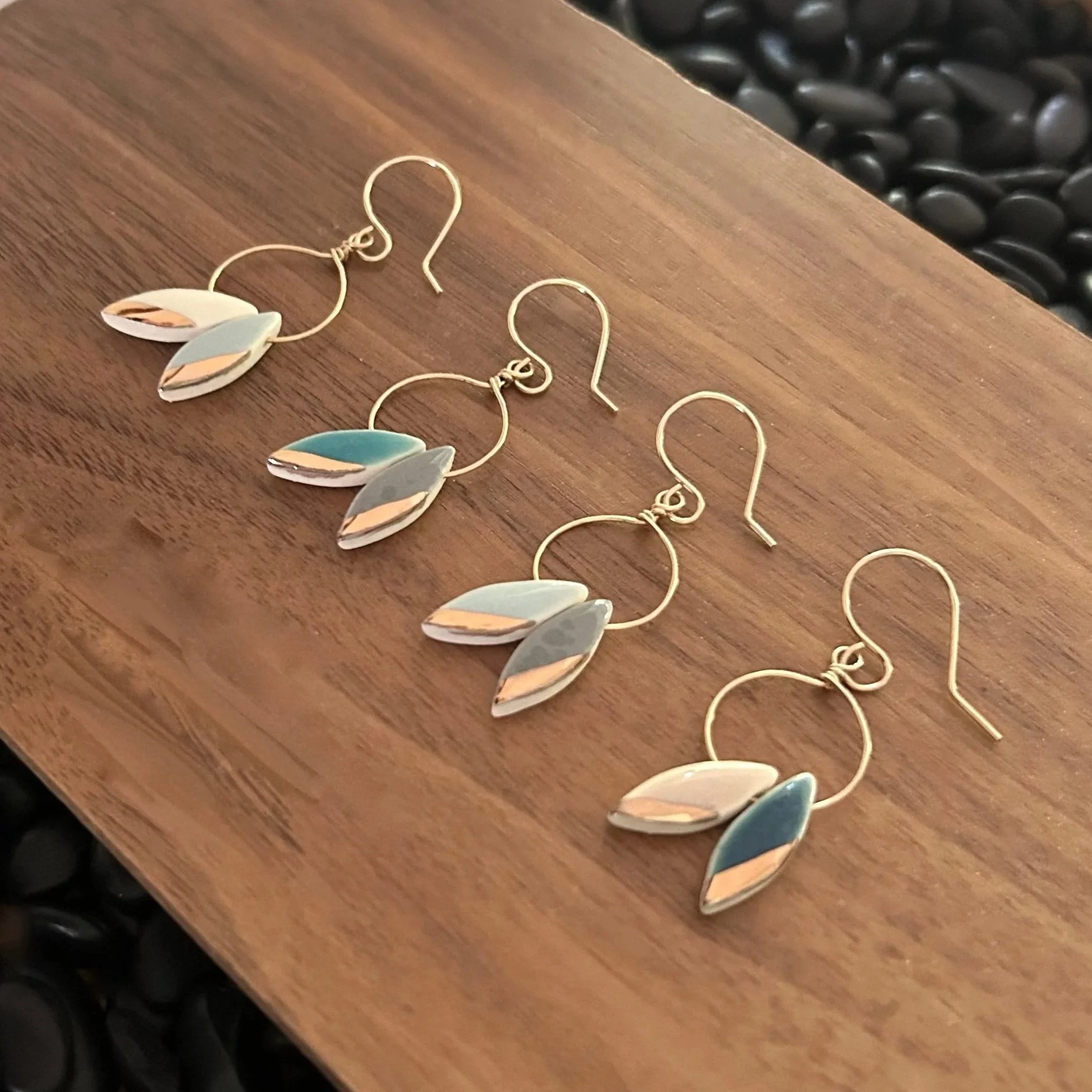 ZOE%CC%88+COMINGS+double+leaf+earrings%2C+4+colorways+wdbkg+a.jpg