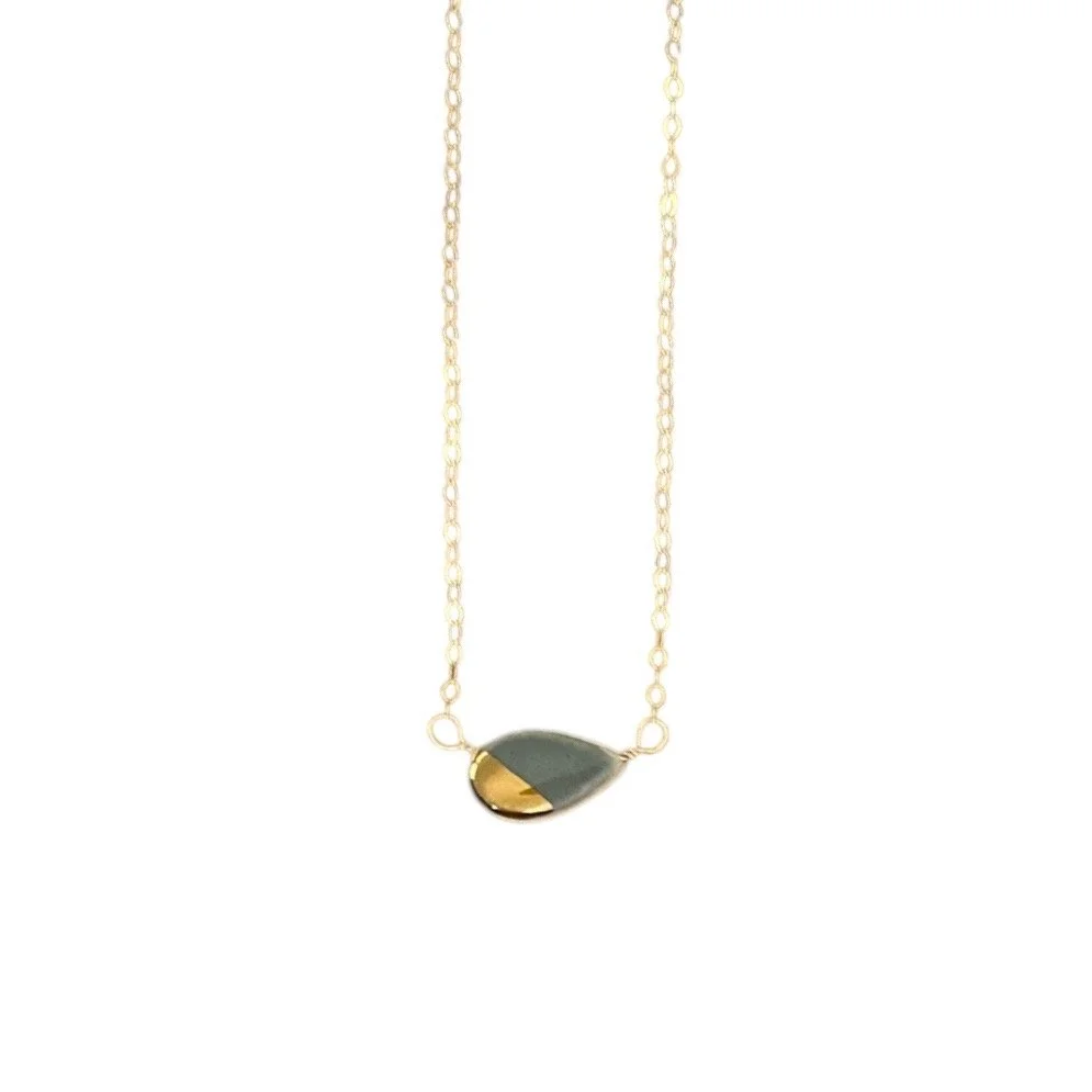 ZOË COMINGS teeny petal necklace, dark grey:gold, wbg.jpg