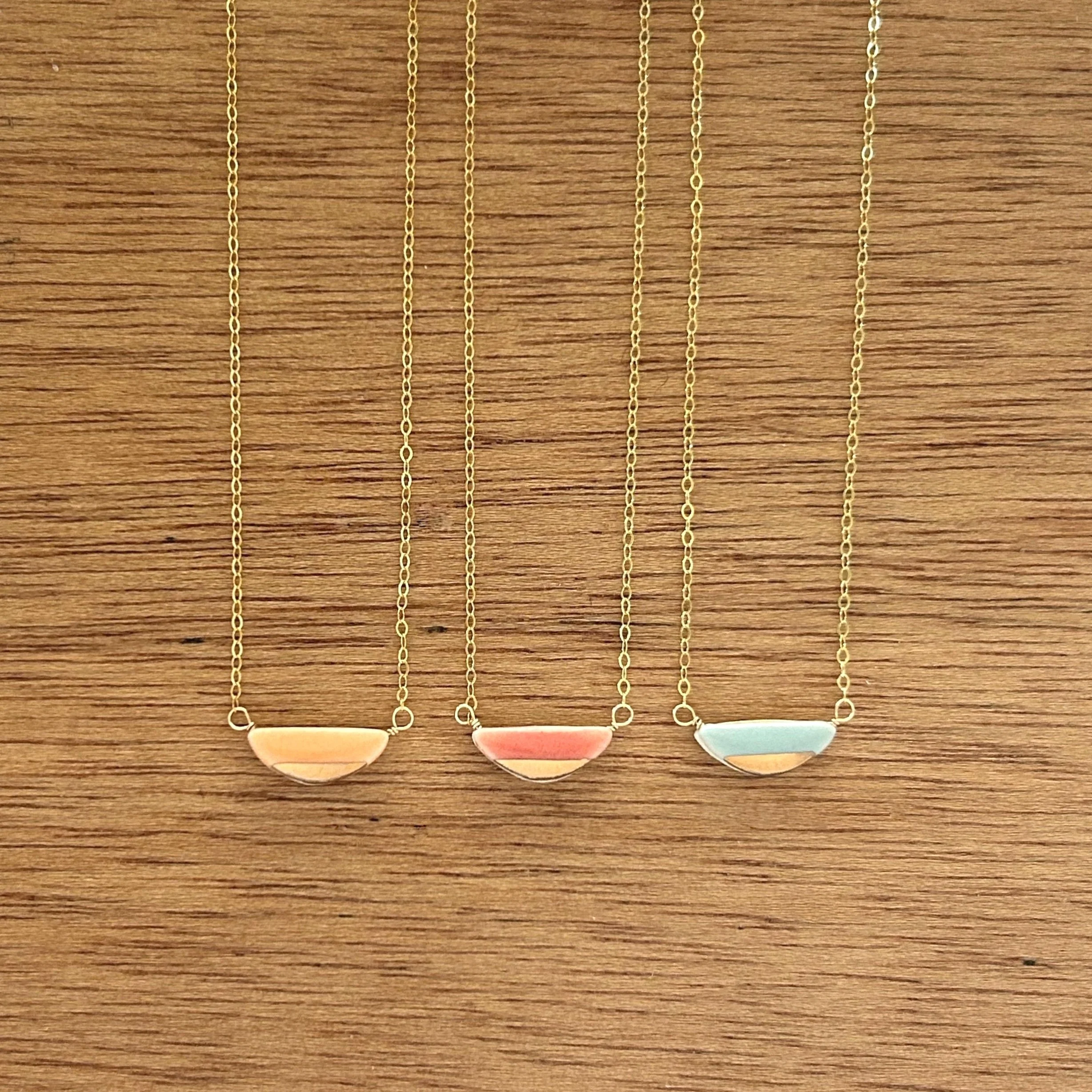 ZOE%CC%88+COMINGS+teeny+half+pebble+necklaces%2C+or%3Acl%3Abl%2C+wdbkg.jpg