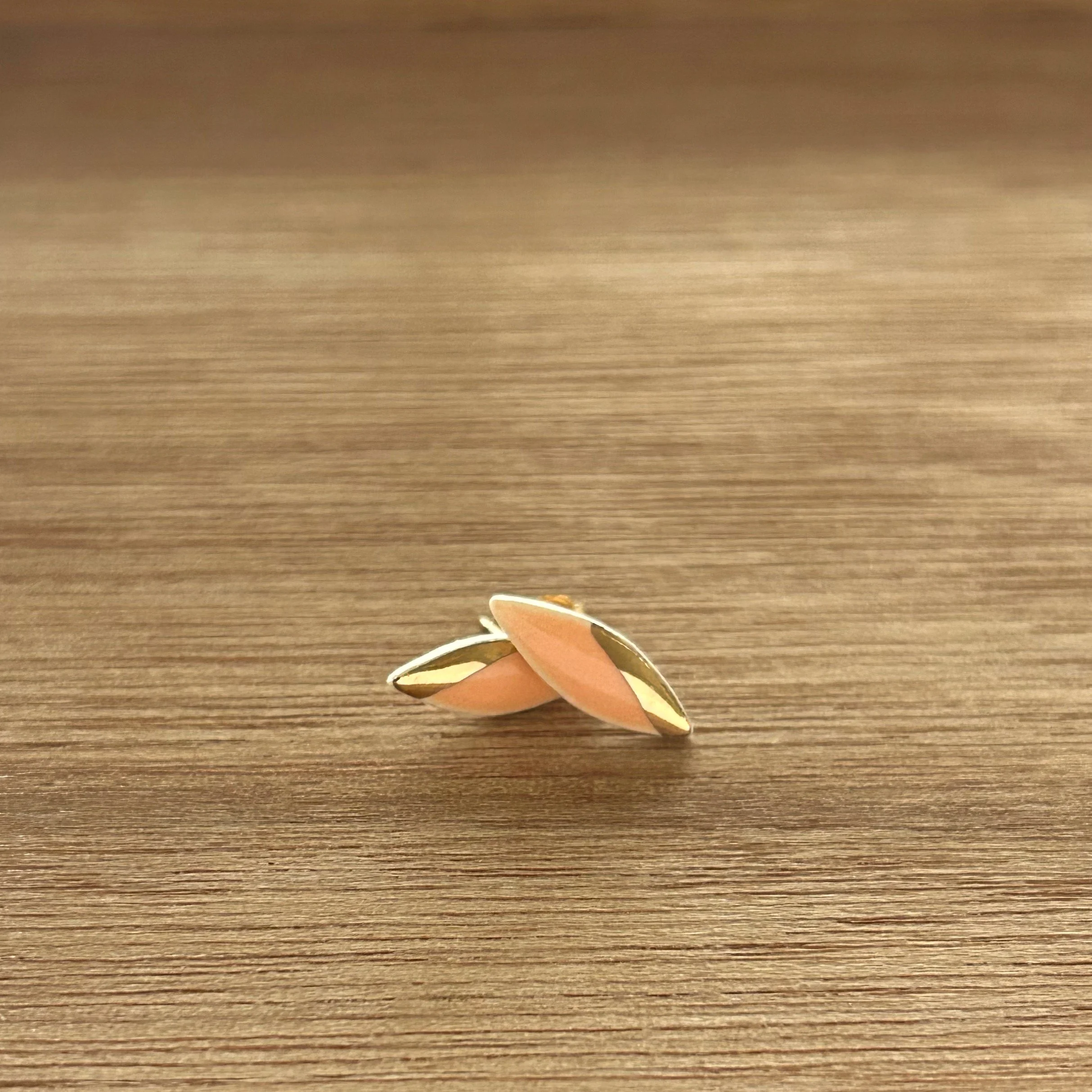 ZOË COMINGS tiny leaf studs, bright orange, wdbkg stacked.jpg