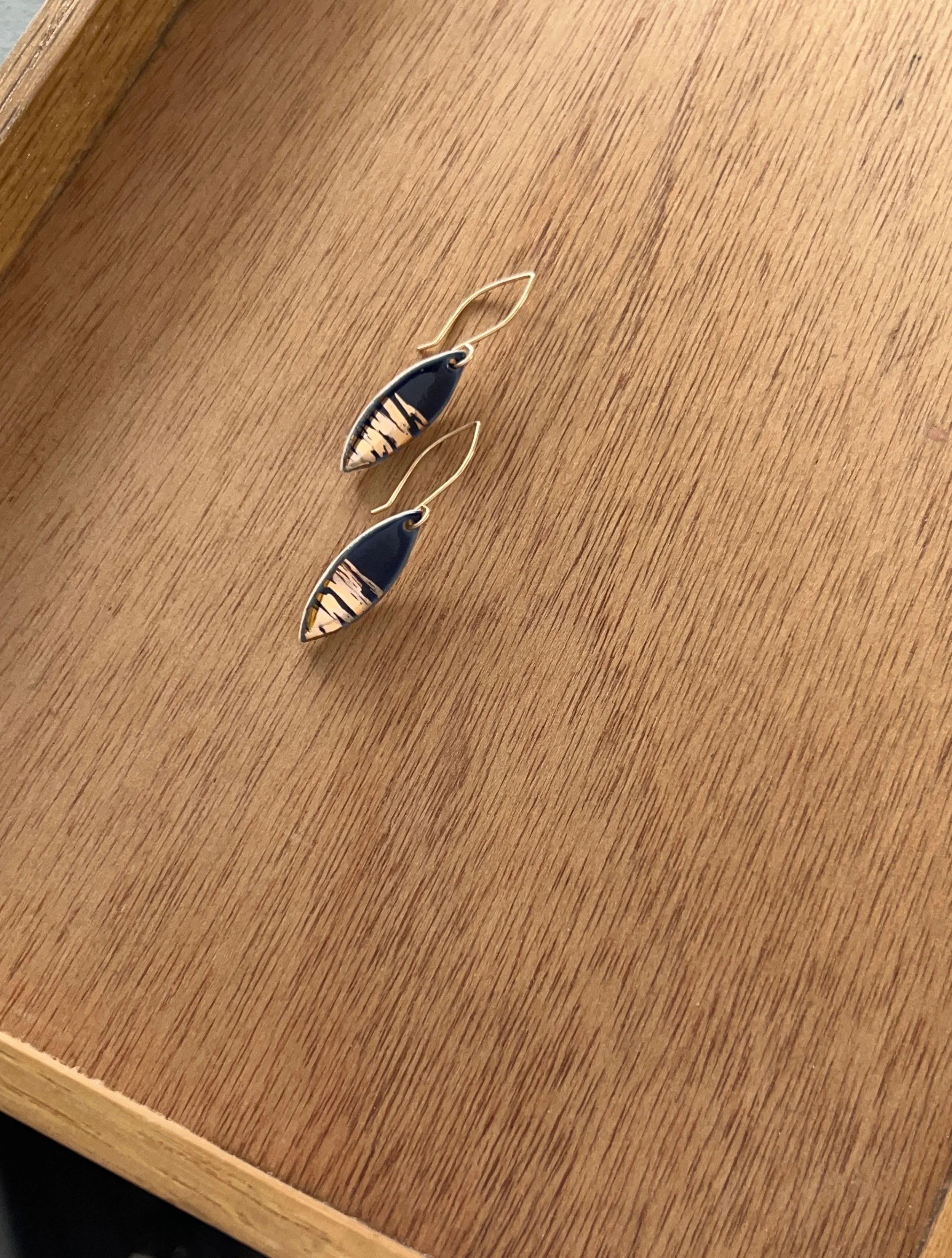 ZOË COMINGS leaf earrings, shimmer navy wdbkg a.jpg