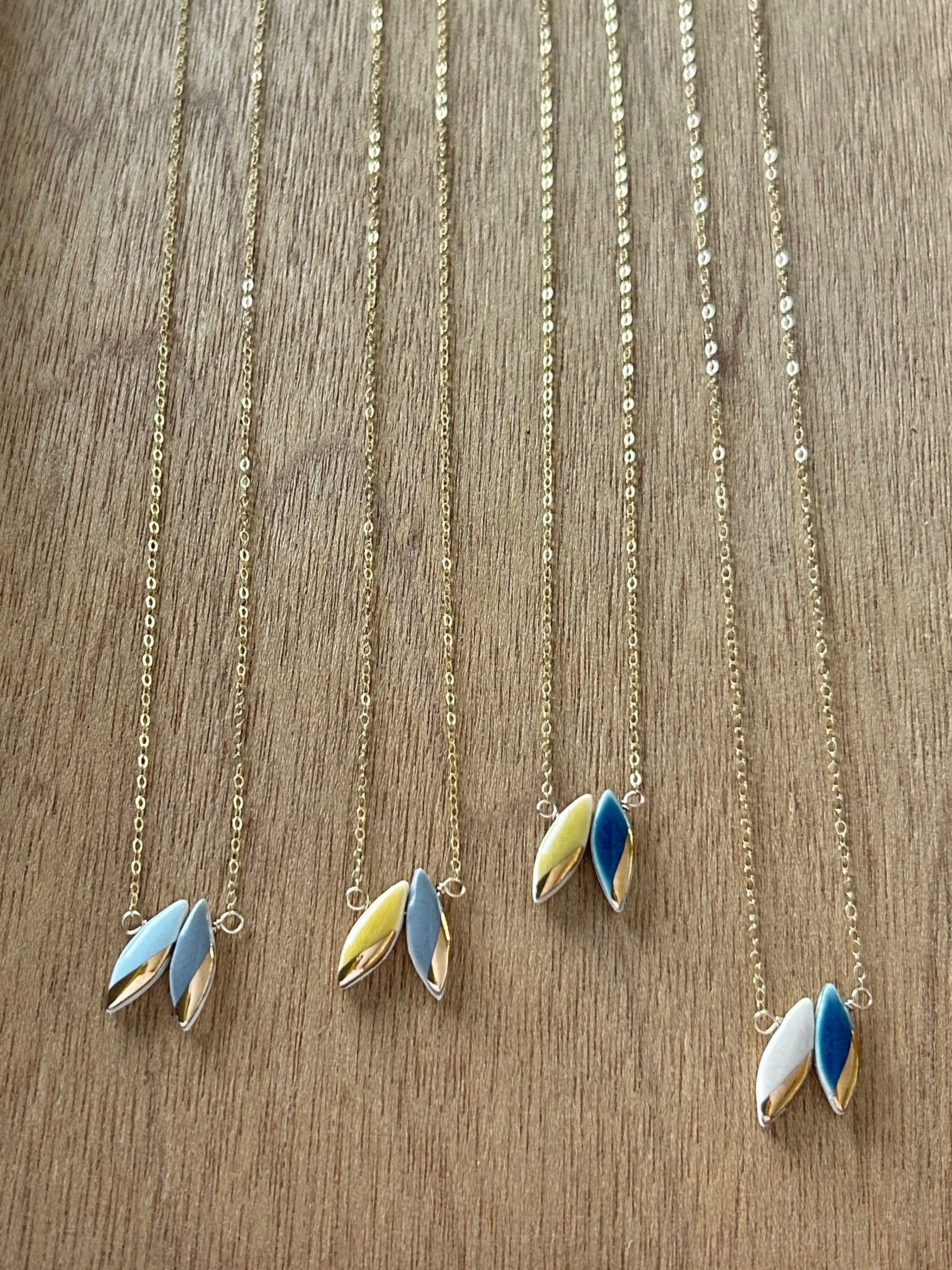 ZOË COMINGS double leaf necklace fall 2026 collection wdbkg.jpg
