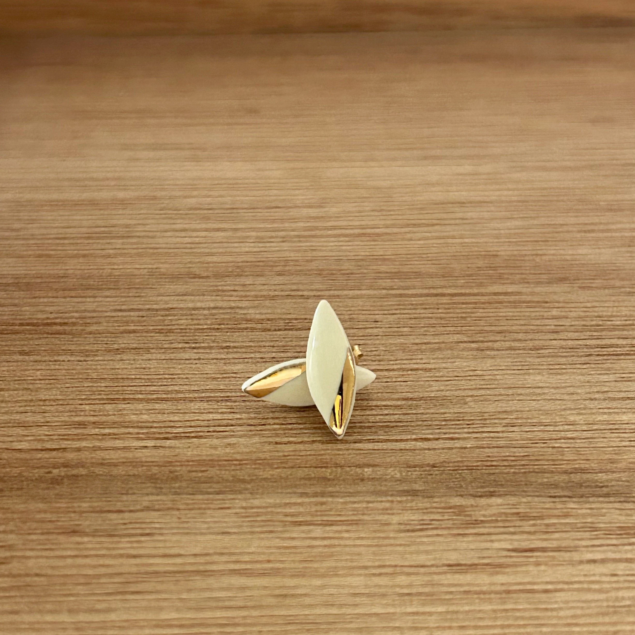 ZOË COMINGS tiny leaf studs, white, wdbkg stacked.jpg
