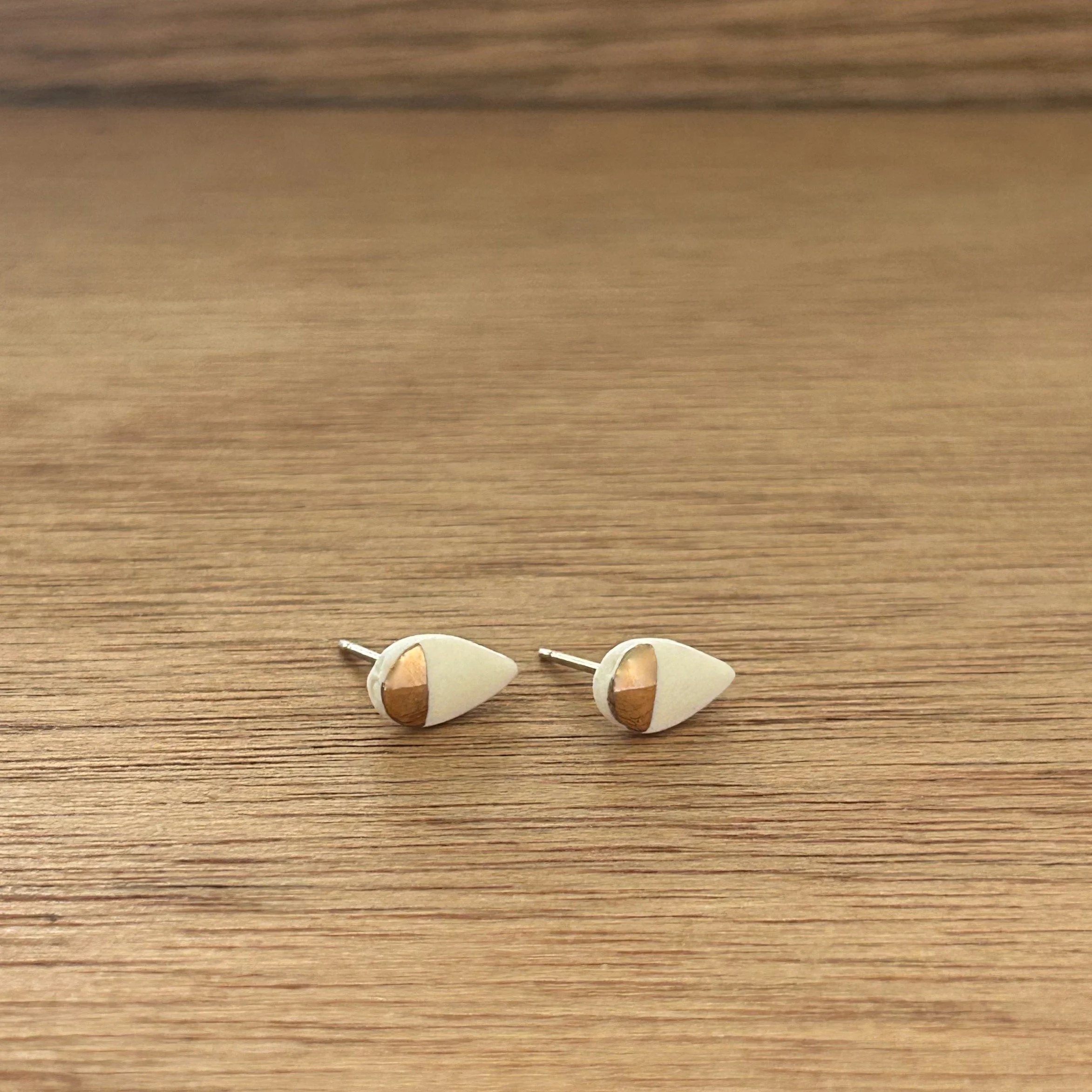 ZOË COMINGS tiny petal studs, white:gold half, a wdbkg.jpg