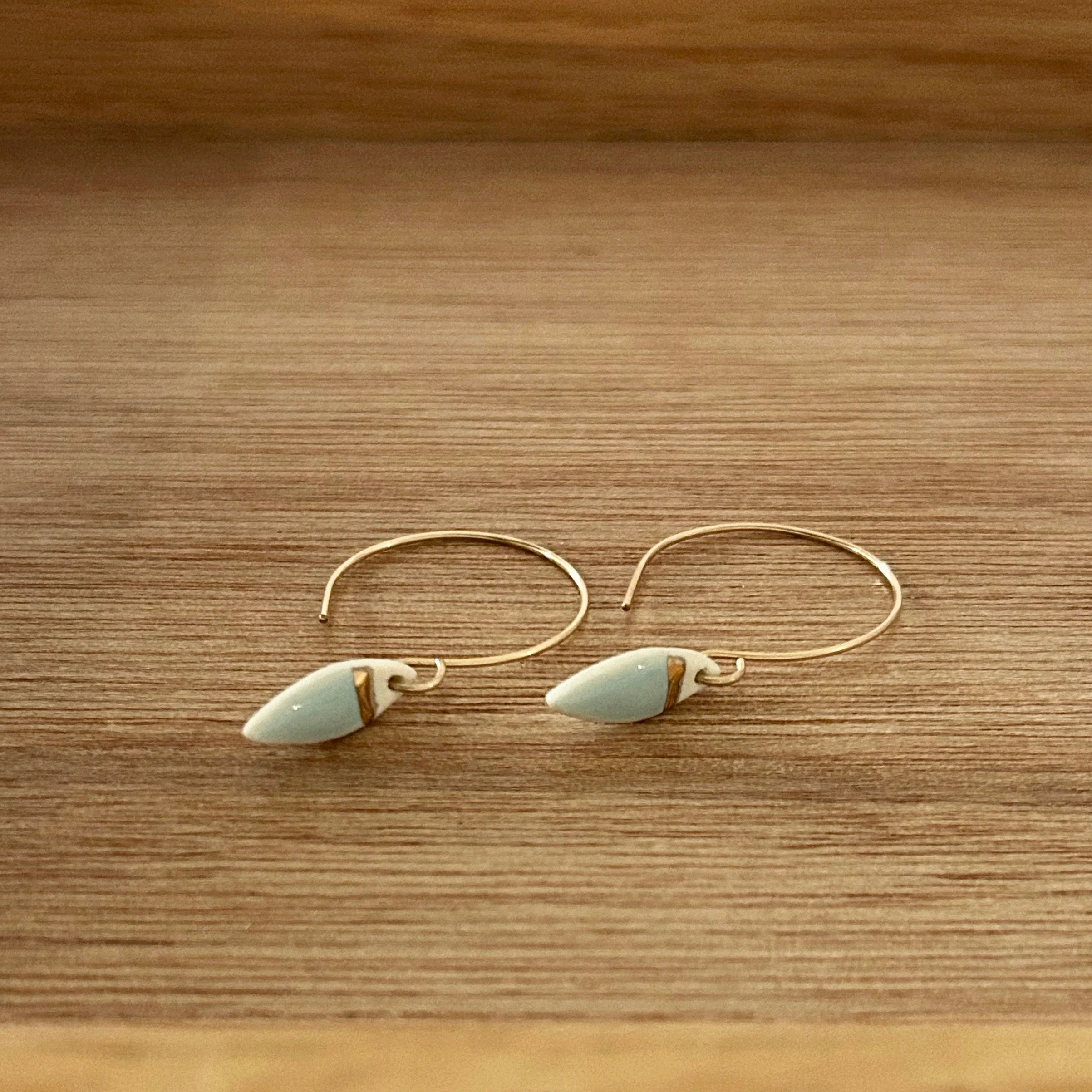 ZOË COMINGS tiny leaf hoops, pale blue, wdbkg a.jpg