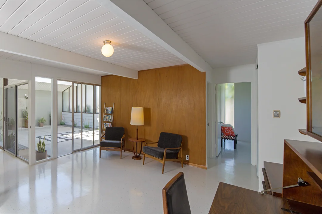 Many of our vintage pieces populate and harmonize with the space including a cute, compact wall unit, two chairs, and a Modeline floorlamp sidetable.