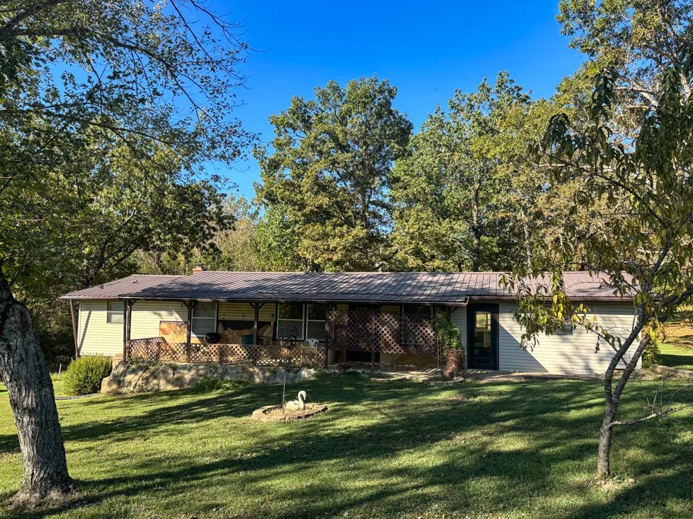 HOME ON HIGHWAY WITH SHOP AND ACREAGE  