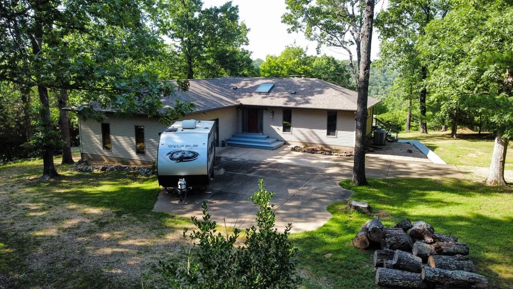  LAKE HOME ON 6 ACRES WITH AVAILABLE BOAT SLIP    $479,000