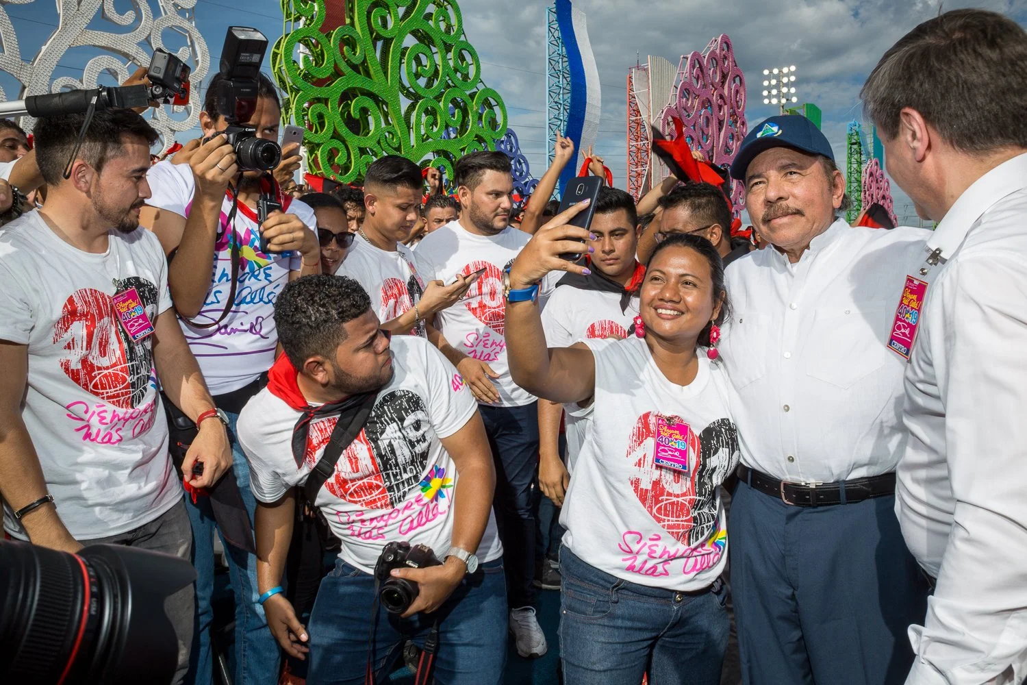 Daniel Ortega with crowd taking selfies during the 40th  anniversary of the Sandinistas Revolution.
